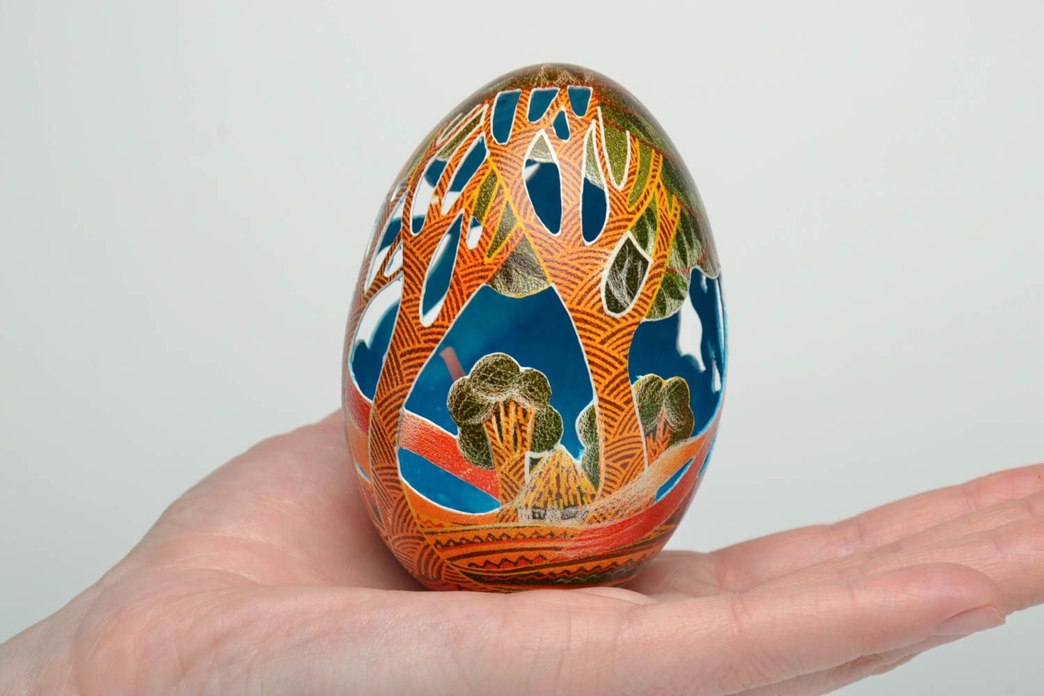 Easter egg painted with aniline dyes and decorated using carving technique photo 5