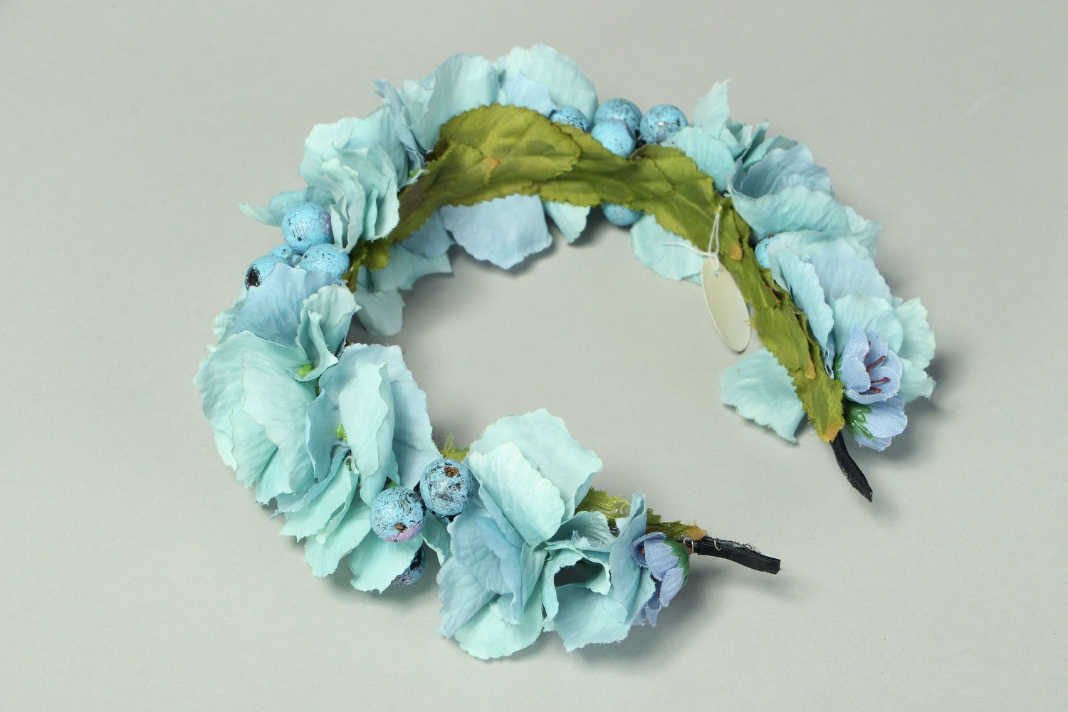 Blue headband with artificial flowers photo 2