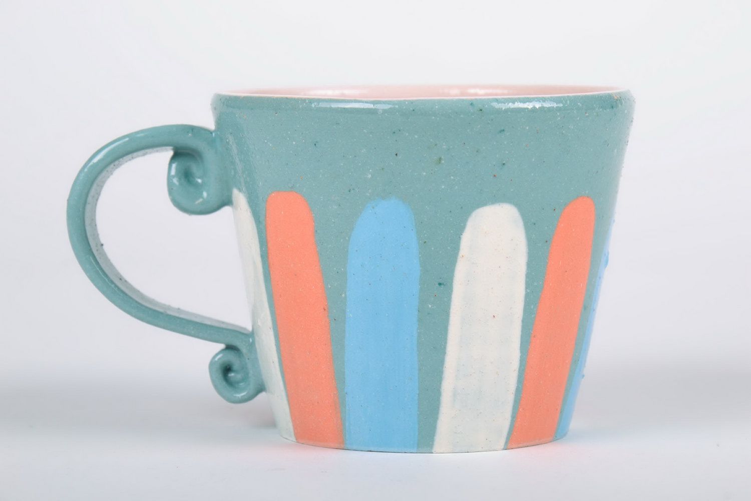 Porcelain cup with handle in blue, white, and orange color photo 4