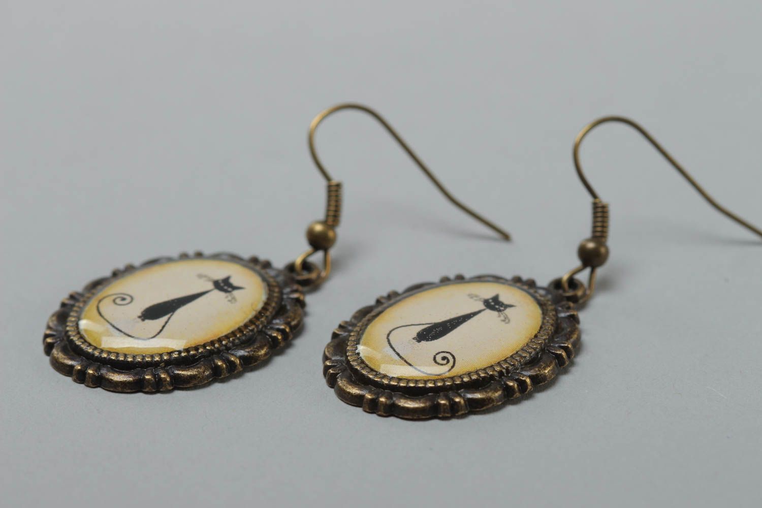 Beautiful beige handmade dangle oval earrings with kitties image photo 3