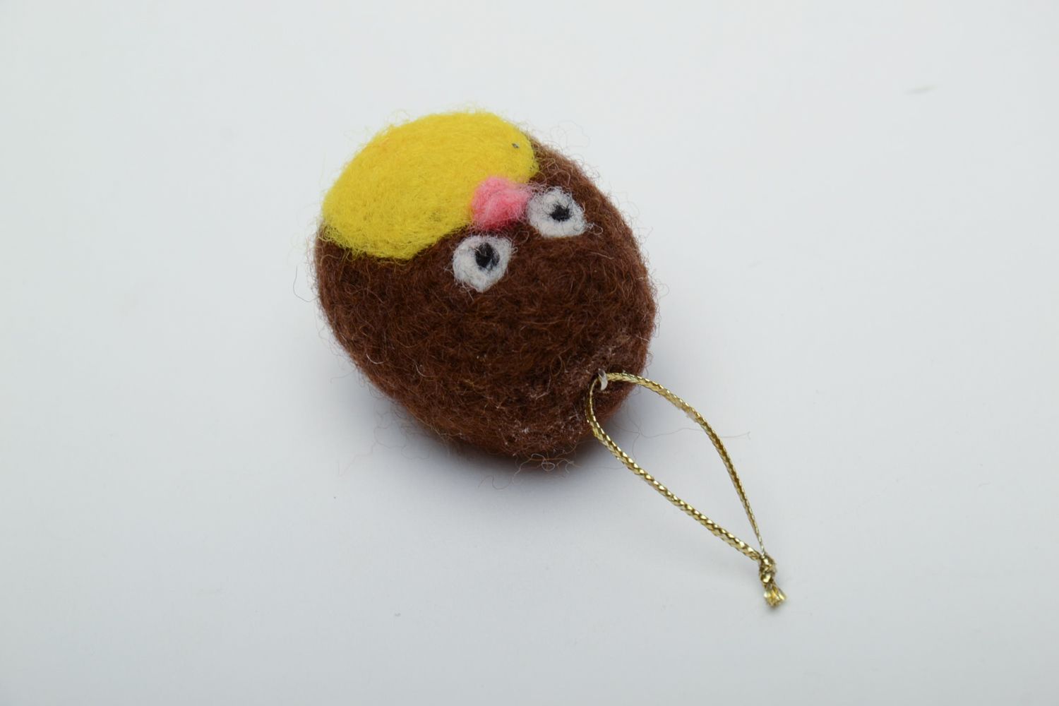 Small felted toy with eyelet photo 3