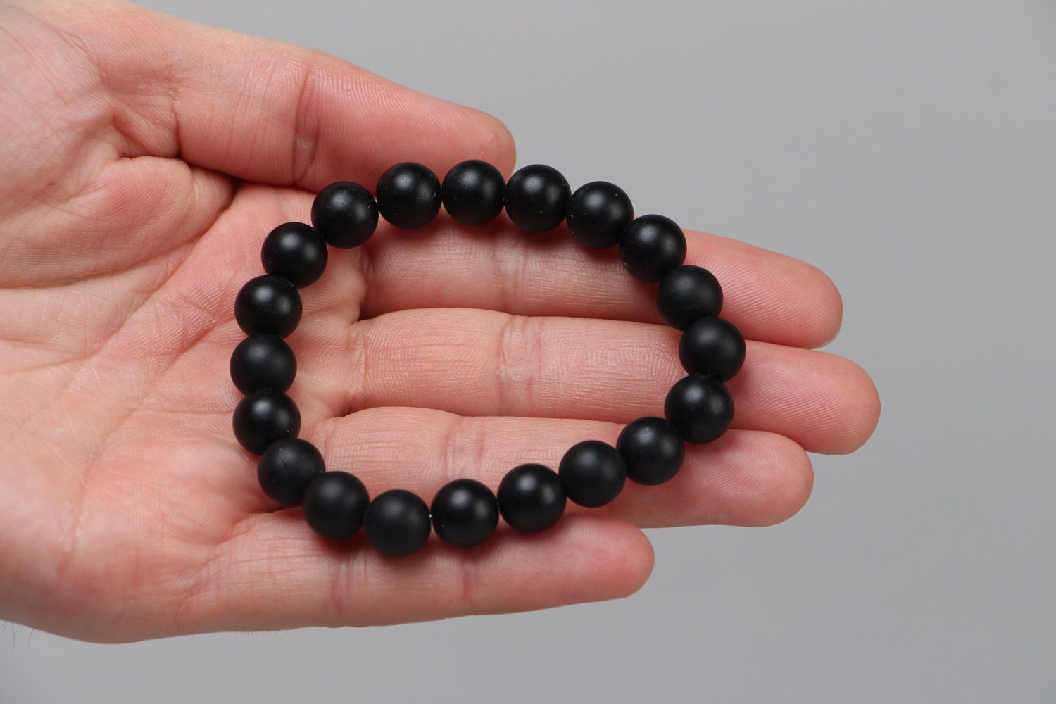 Handmade wrist stretch bracelet with natural stone beads of black color photo 3
