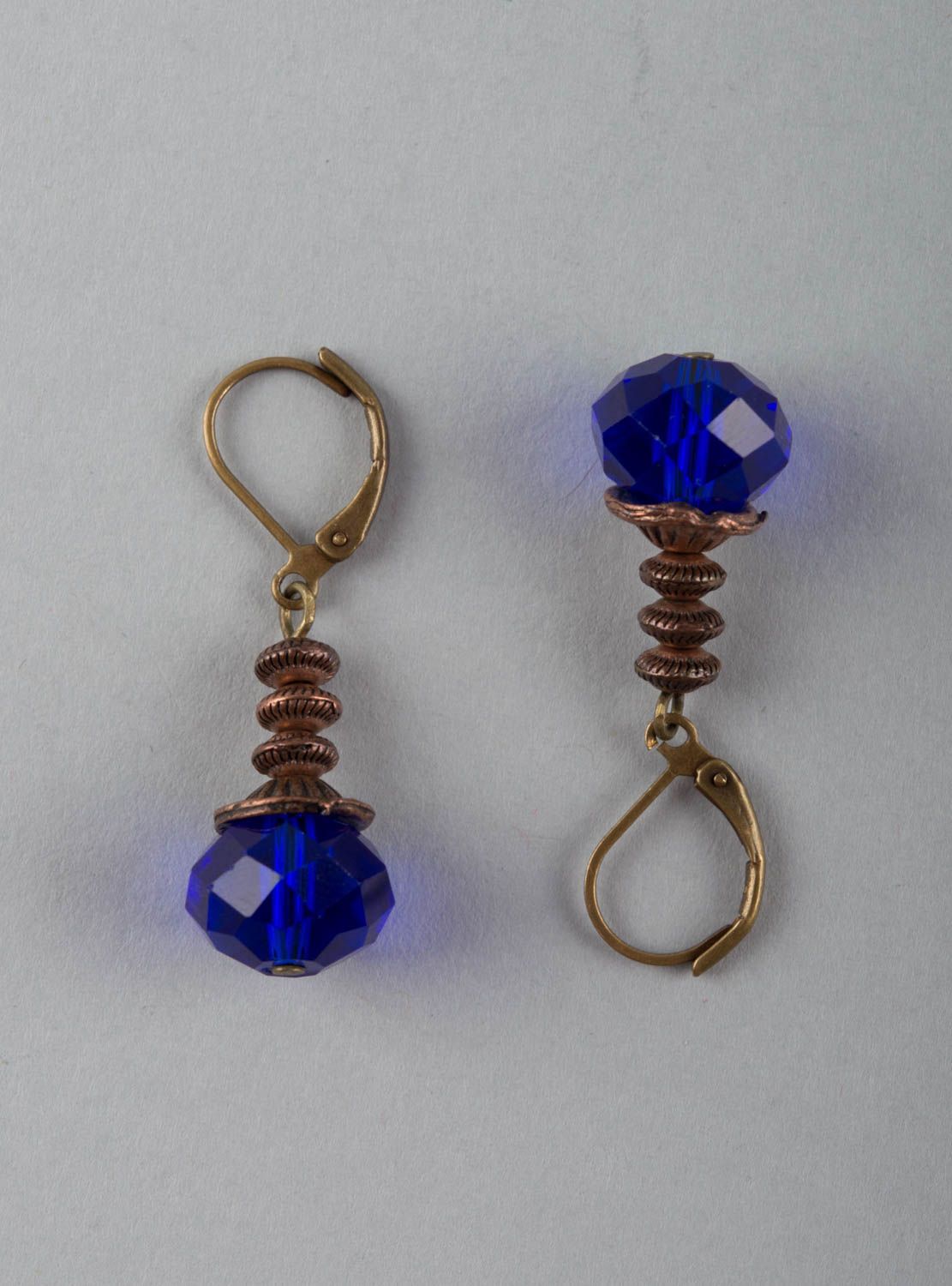 Unusual beautiful elegant handmade brass earrings with crystals of blue color photo 2