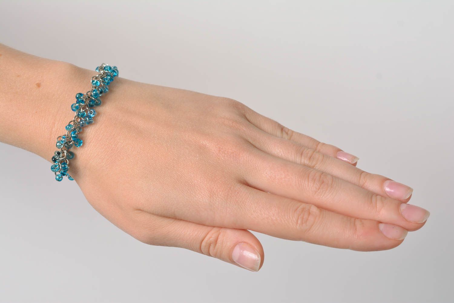Designer women's wrist bracelet with blue beads and metal handmade stylish photo 2