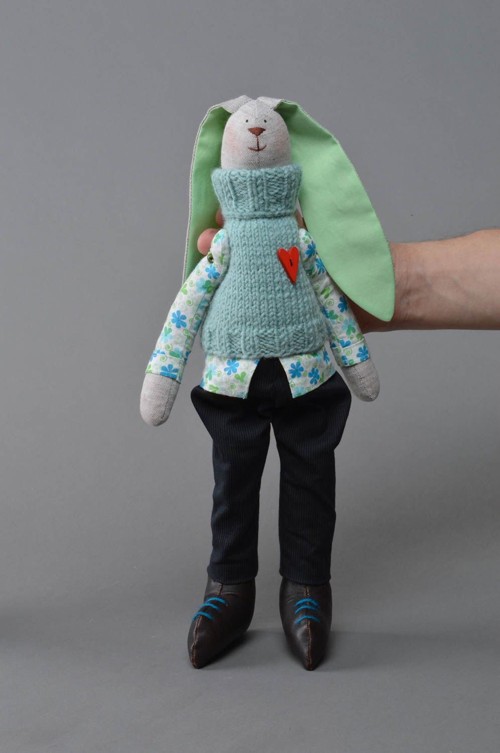 Handmade decorative soft toy bunny made of flax in knitted vest designer doll photo 1