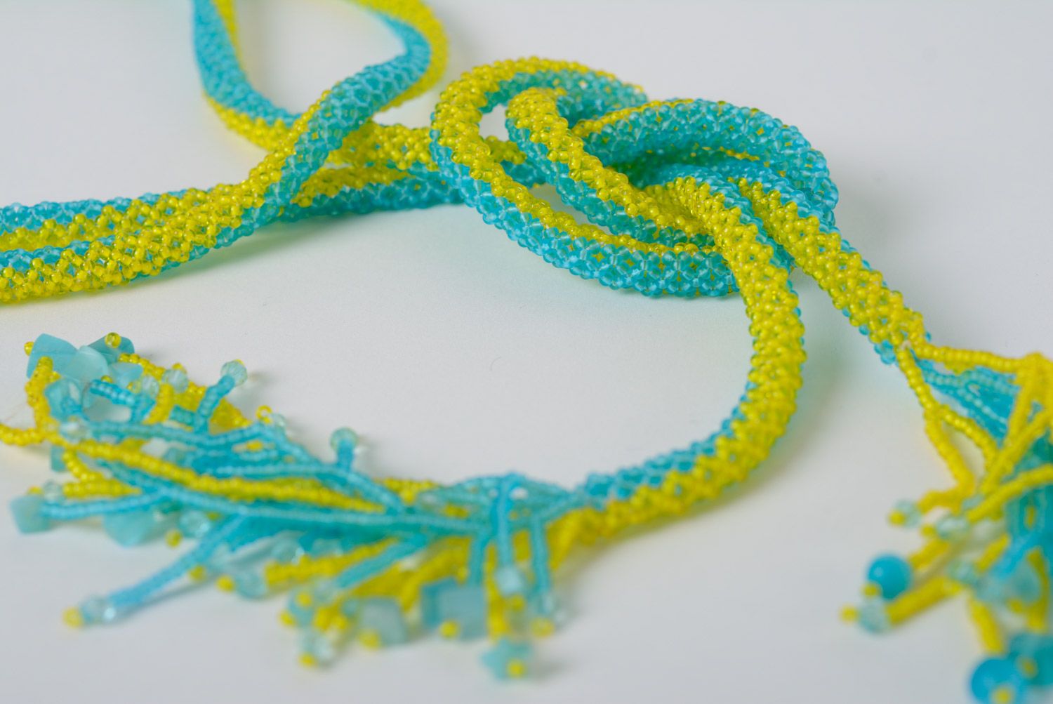 Beautiful long handmade necklace woven of beads of yellow and blue colors photo 4