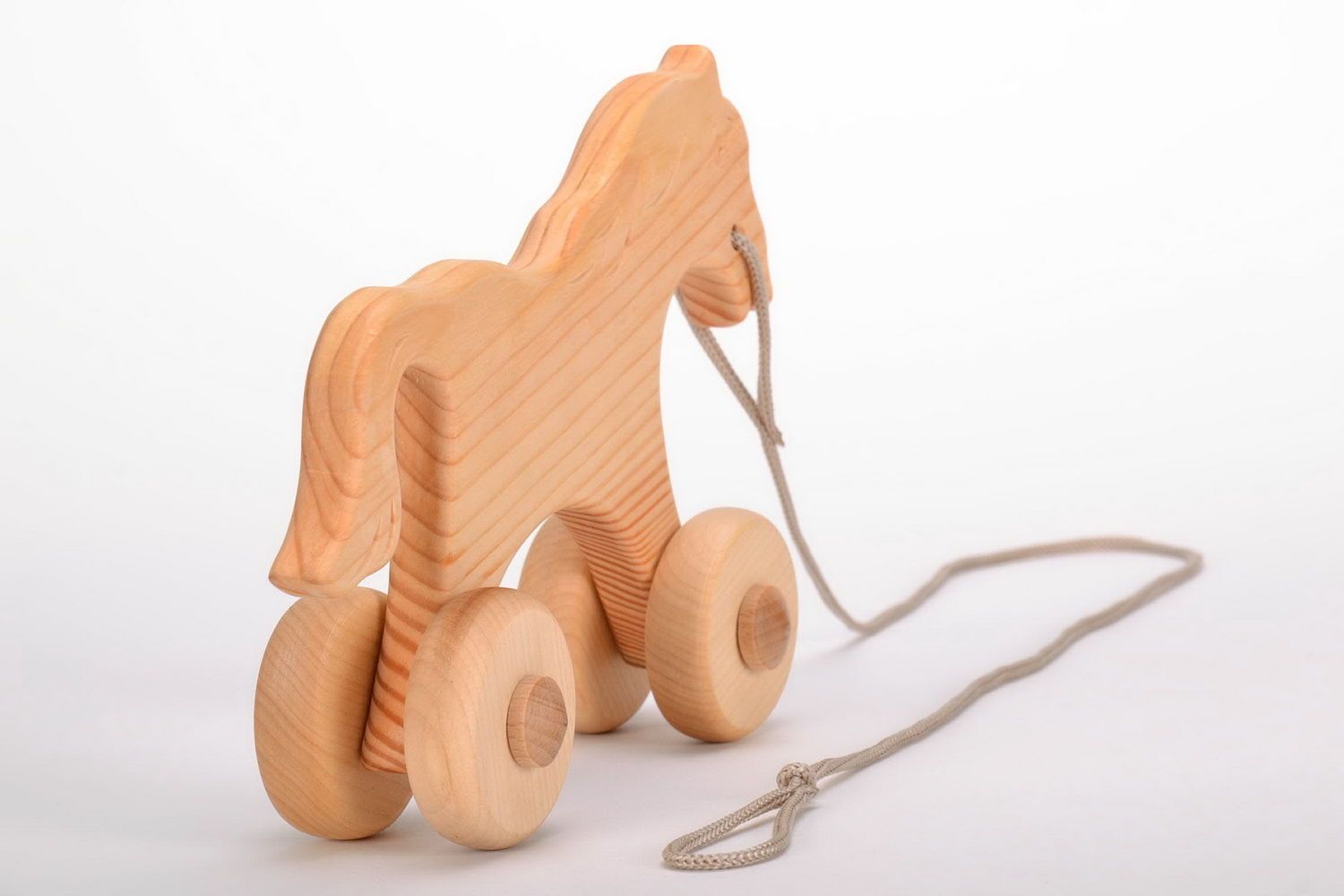 Spielzeug Pferd aus Holz foto 2