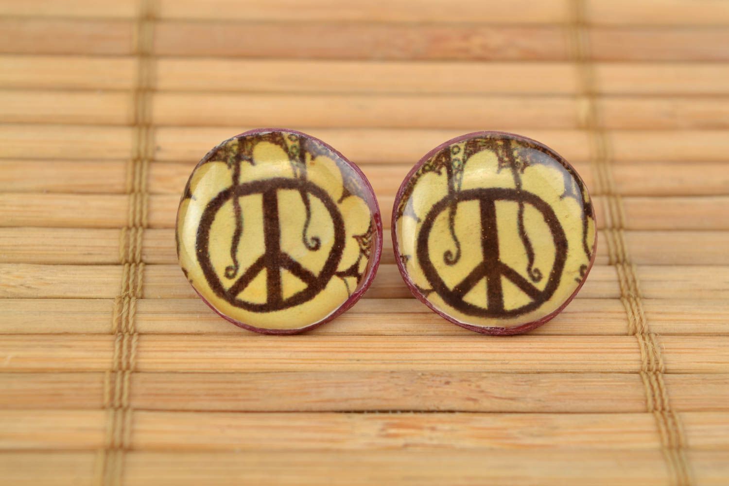 Handmade polymer clay stud earrings with decoupage Peace coated with epoxy resin photo 1