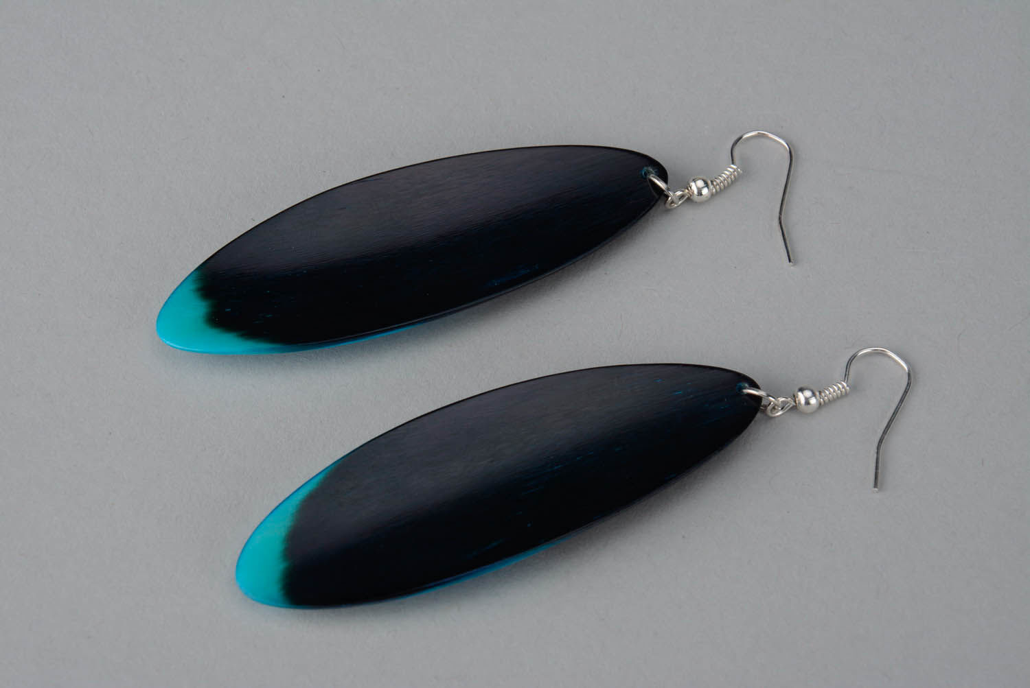 Long earrings made of polished horn photo 2