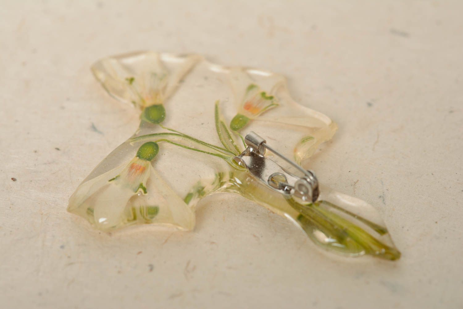Beautiful transparent handmade brooch with dried flower and epoxy coating photo 3