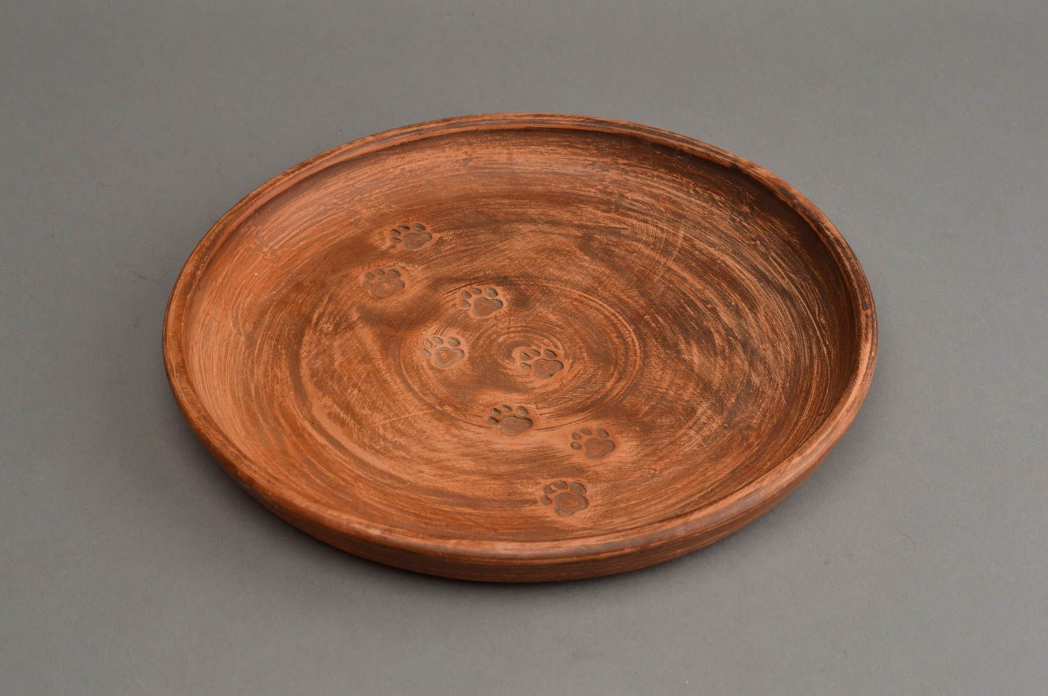 Handmade ceramic plate made of red clay with embossing for serving dishes photo 5