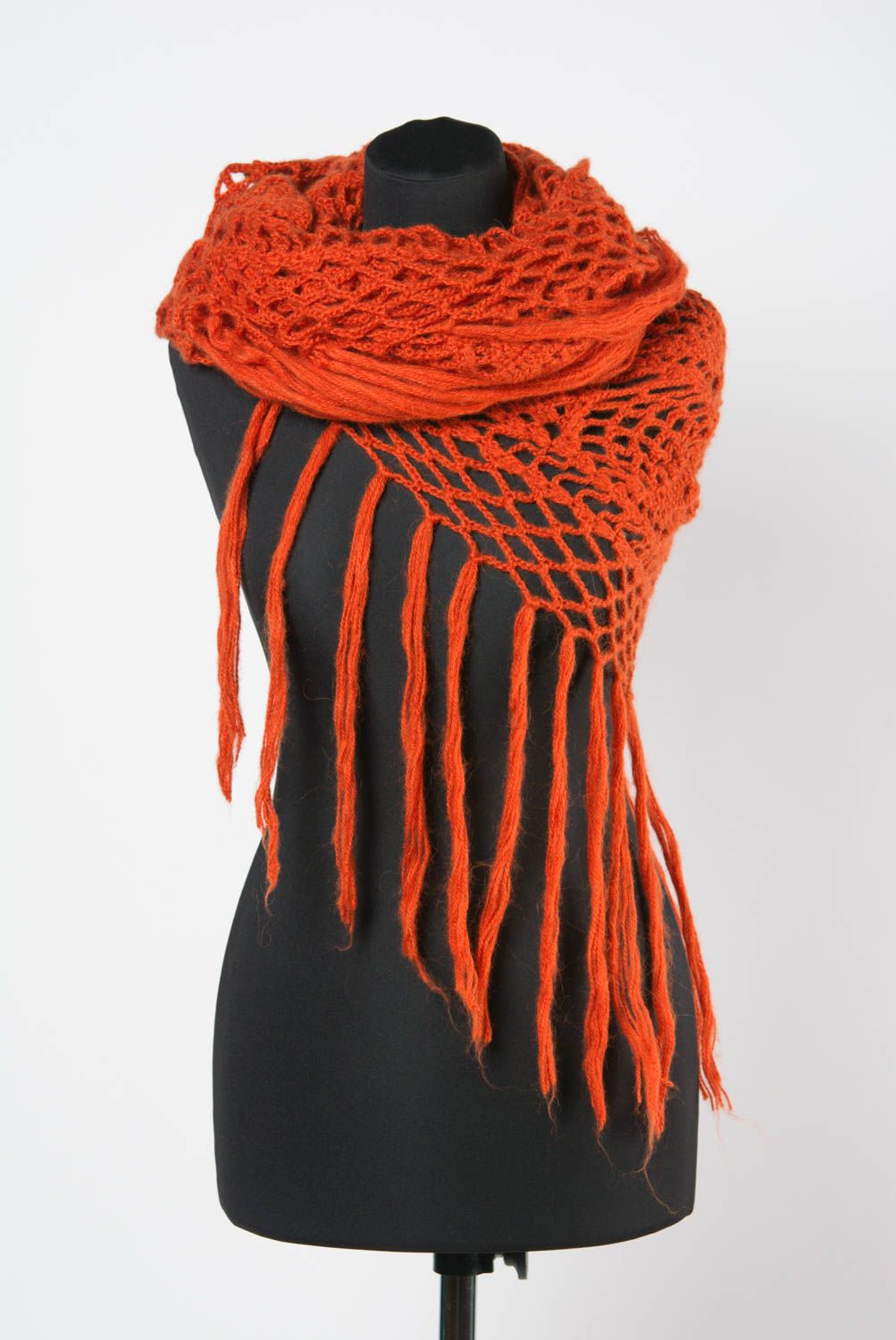 Handmade warm lace women's shawl knitted of wool of bright orange color photo 1