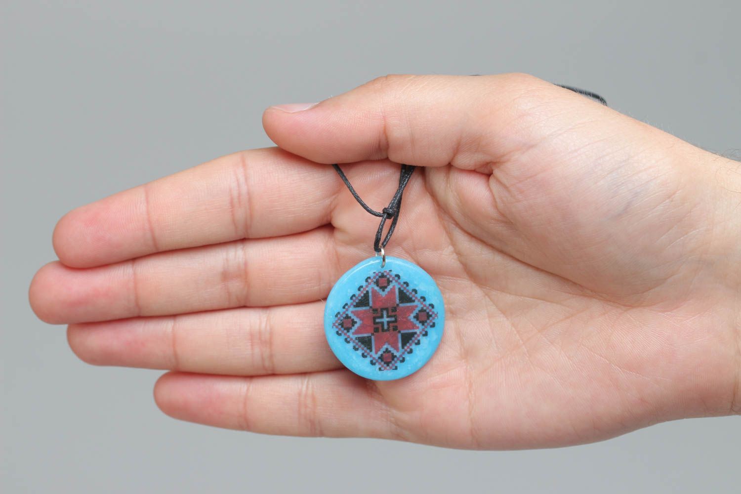 Handmade designer pendant with Ukrainian symbols round blue accessory on cord  photo 5