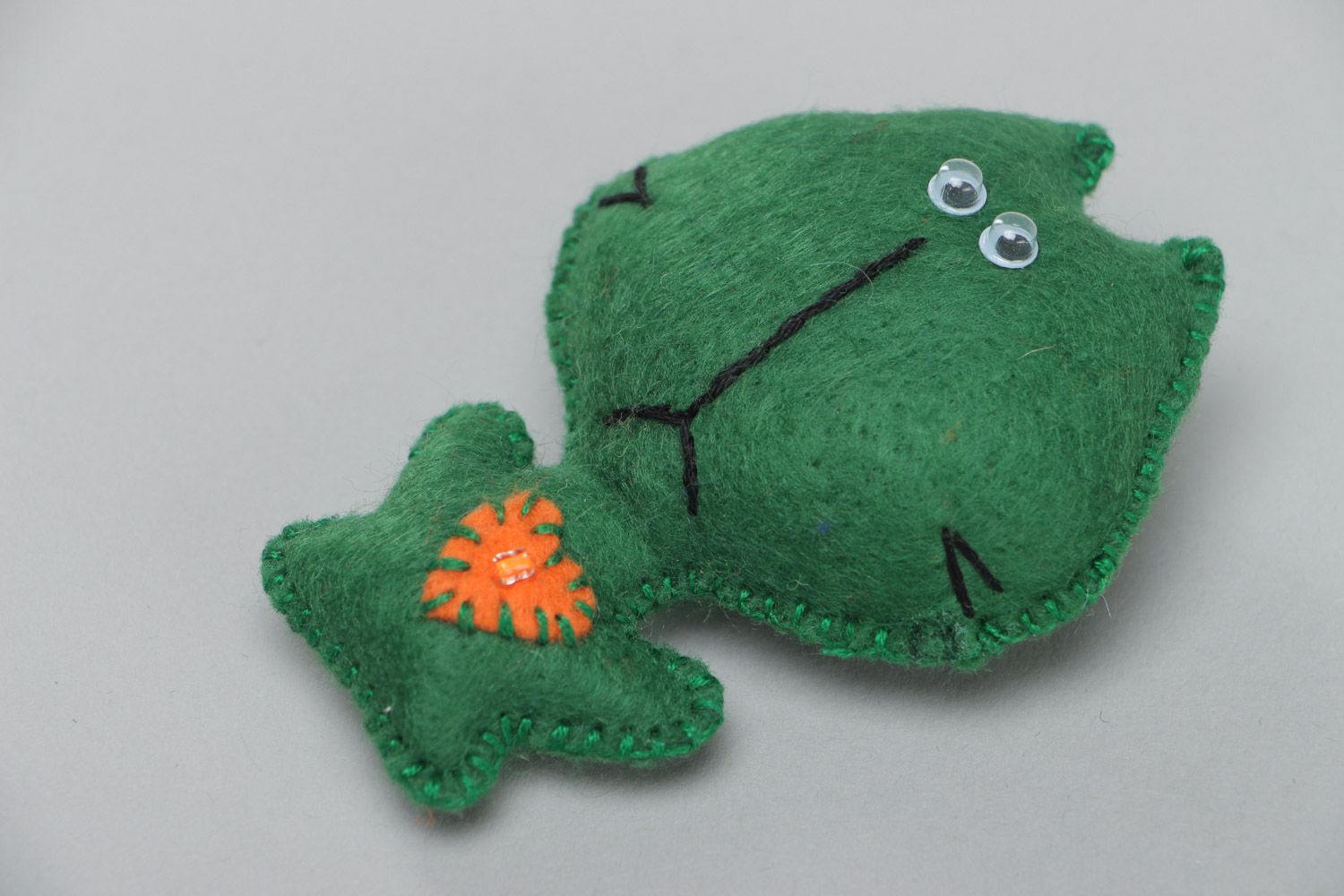 Small handmade soft toy sewn of felt funny green kitten with applique work photo 2