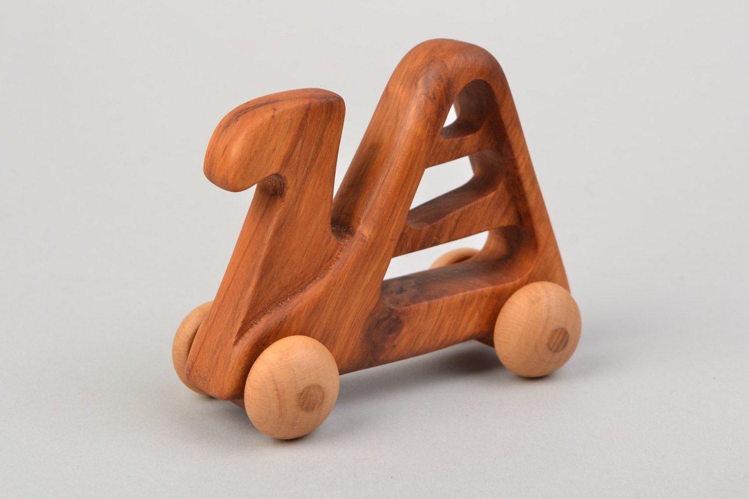 Handmade wooden wheeled toy camel imbued with linseed oil  photo 4