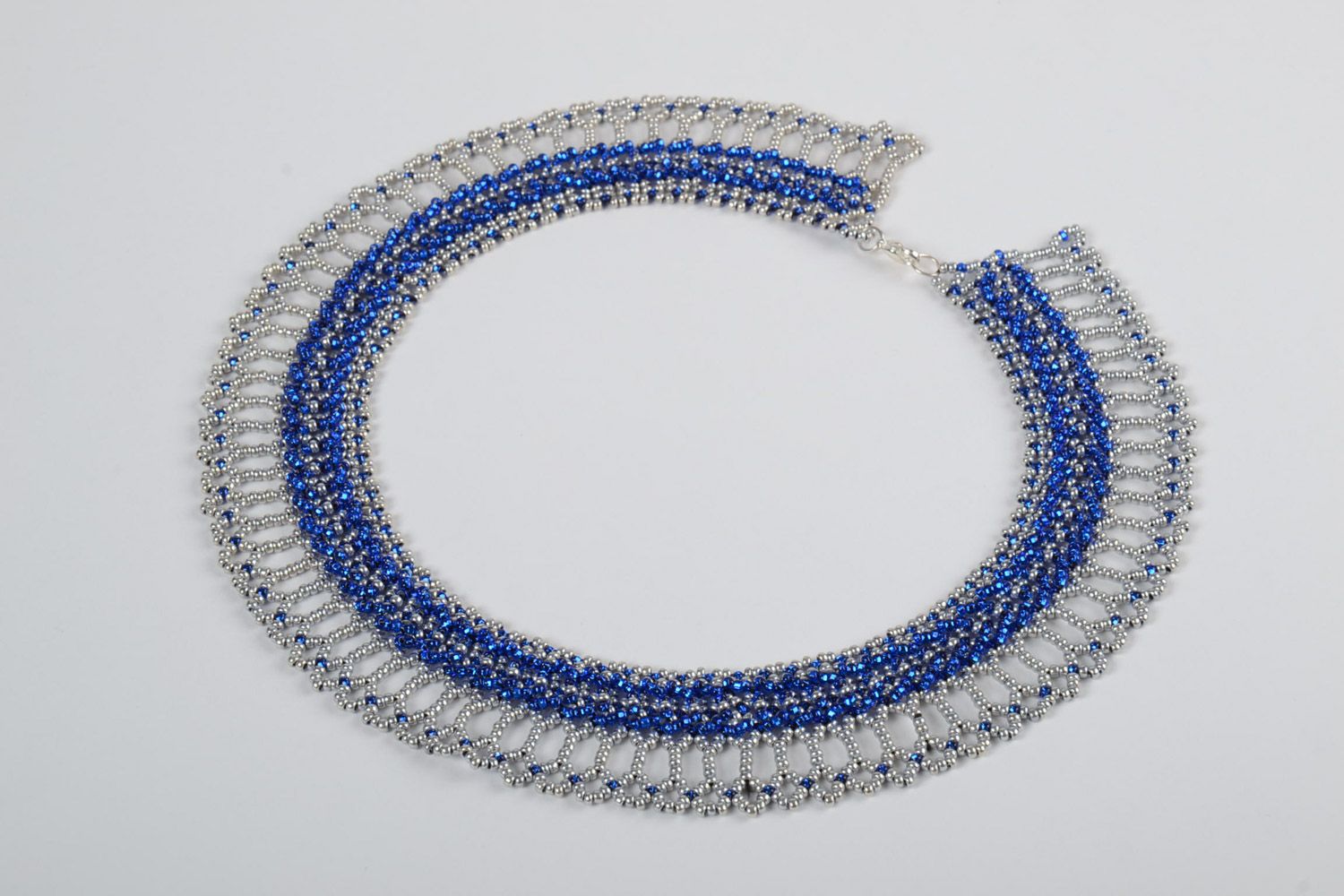 Beautiful lacy handmade women's beaded necklace of blue and white colors photo 2