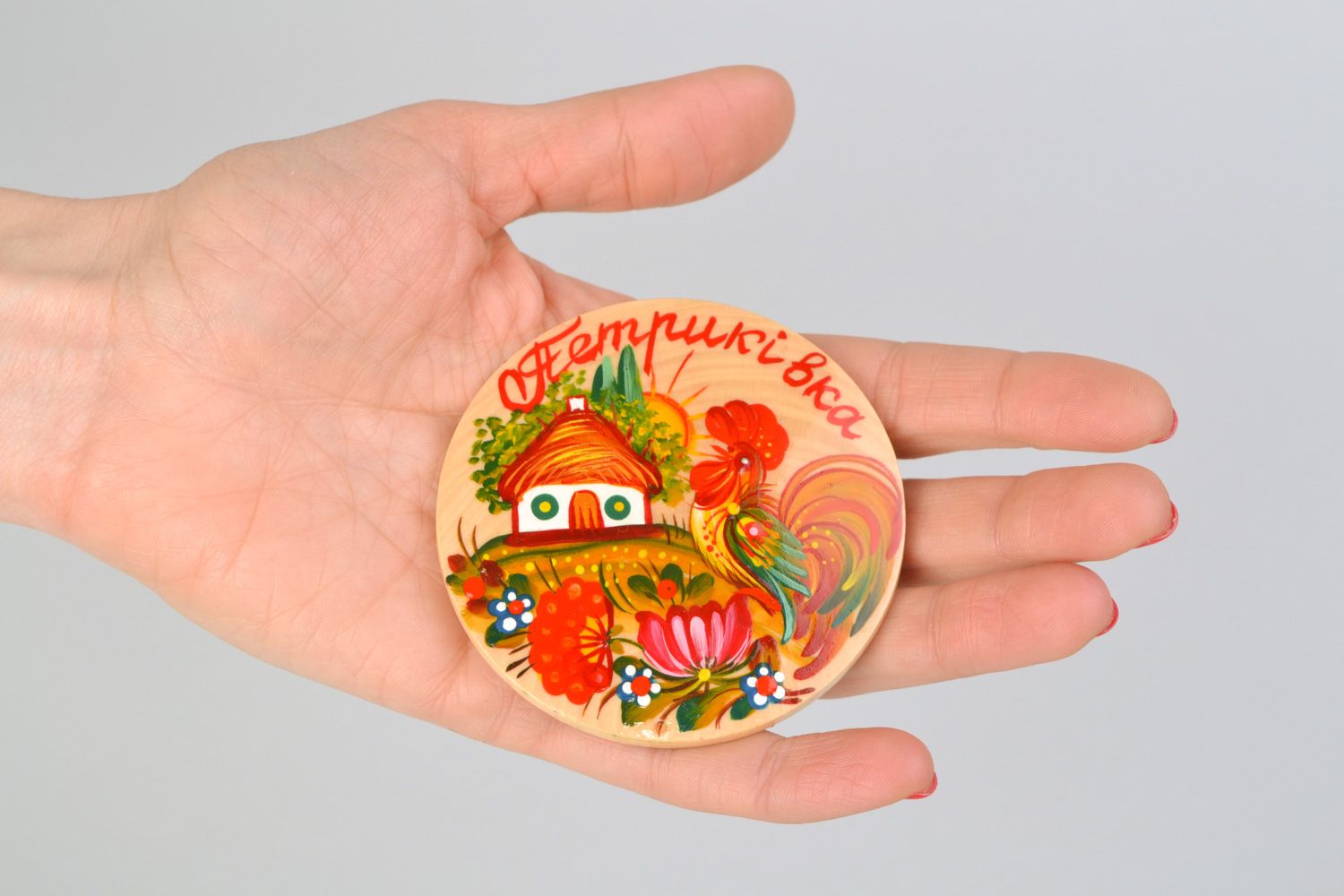 Handmade decorative round fridge magnet with traditional Petrikivka painting photo 2