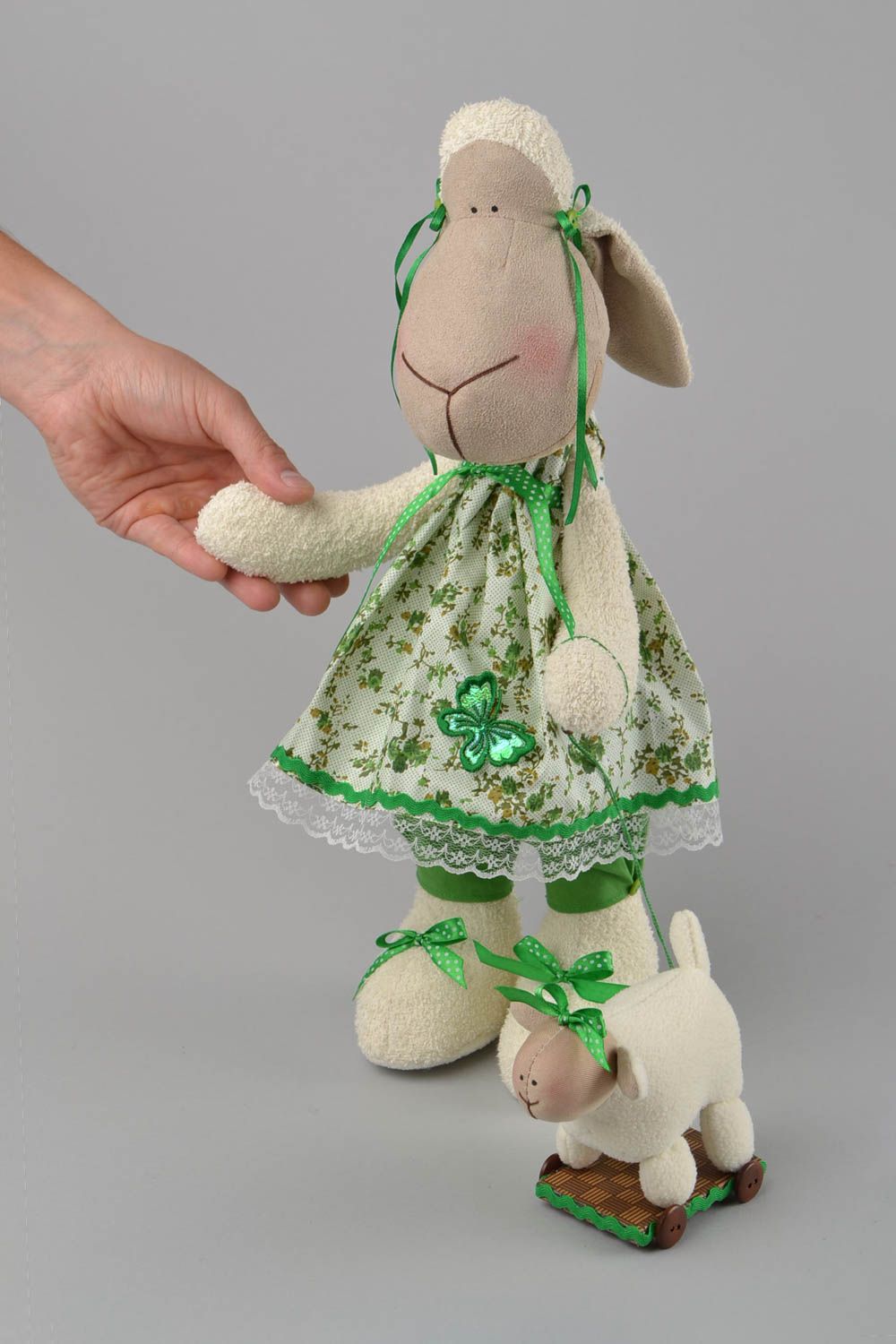 Handmade designer interior fabric soft toy Lamb in green dress with wheeled toy photo 2