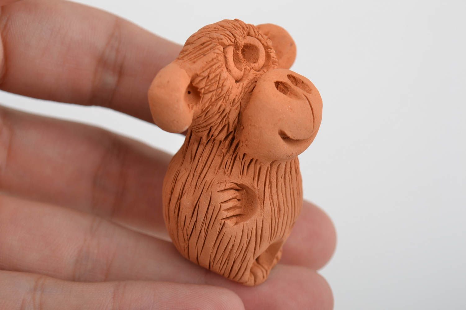 Small brown handmade designer molded red clay statuette of monkey photo 2