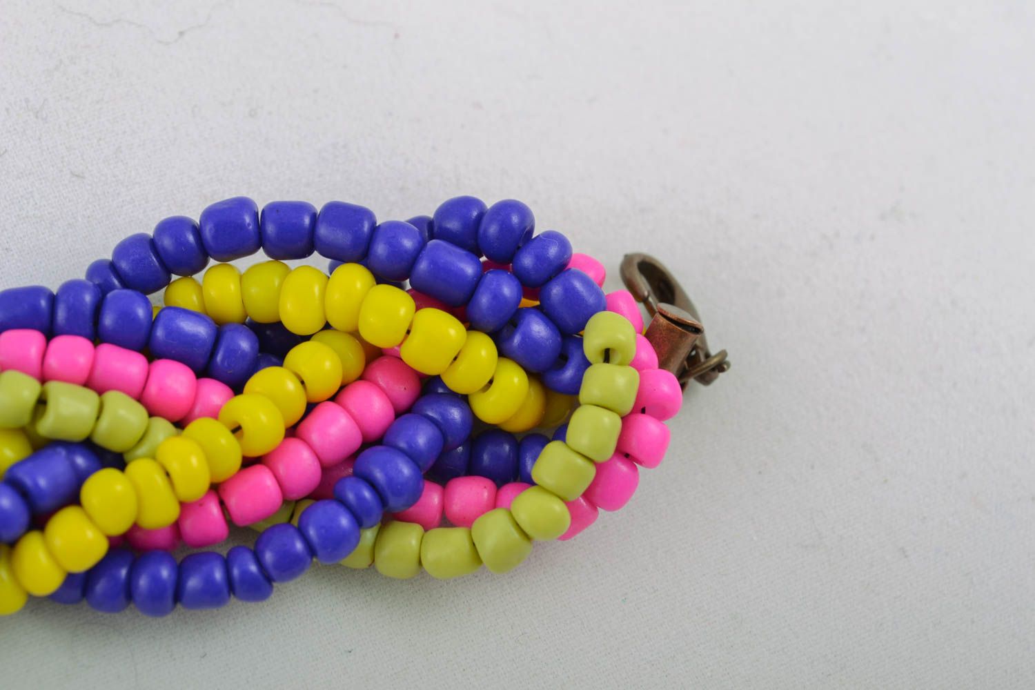 Blue, red, yellow beaded bracelet in the shape of pigtail photo 2