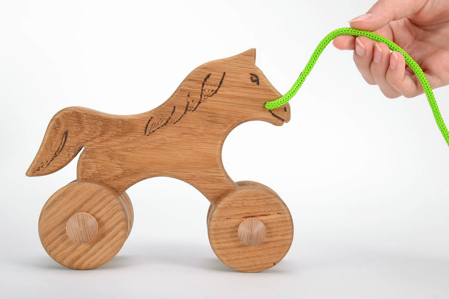 Wooden toy on wheels Horse photo 3