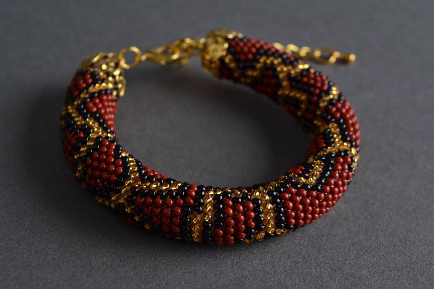 Corded beaded handmade crocheted bracelet with an animal print Python photo 1