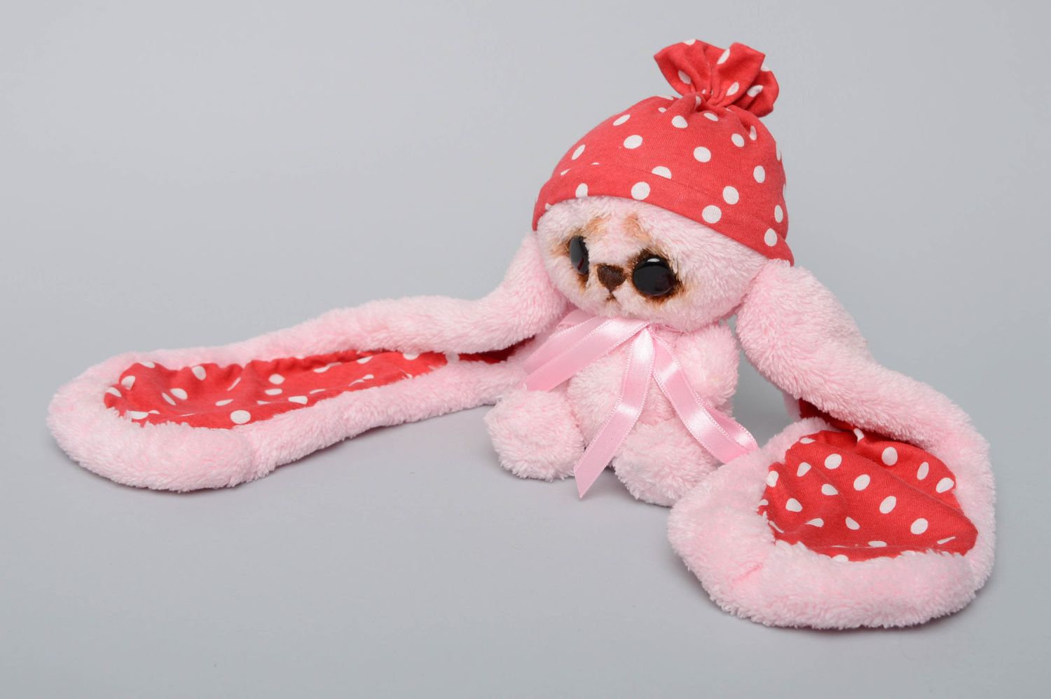 Pink artificial fur toy hare with long ears photo 1