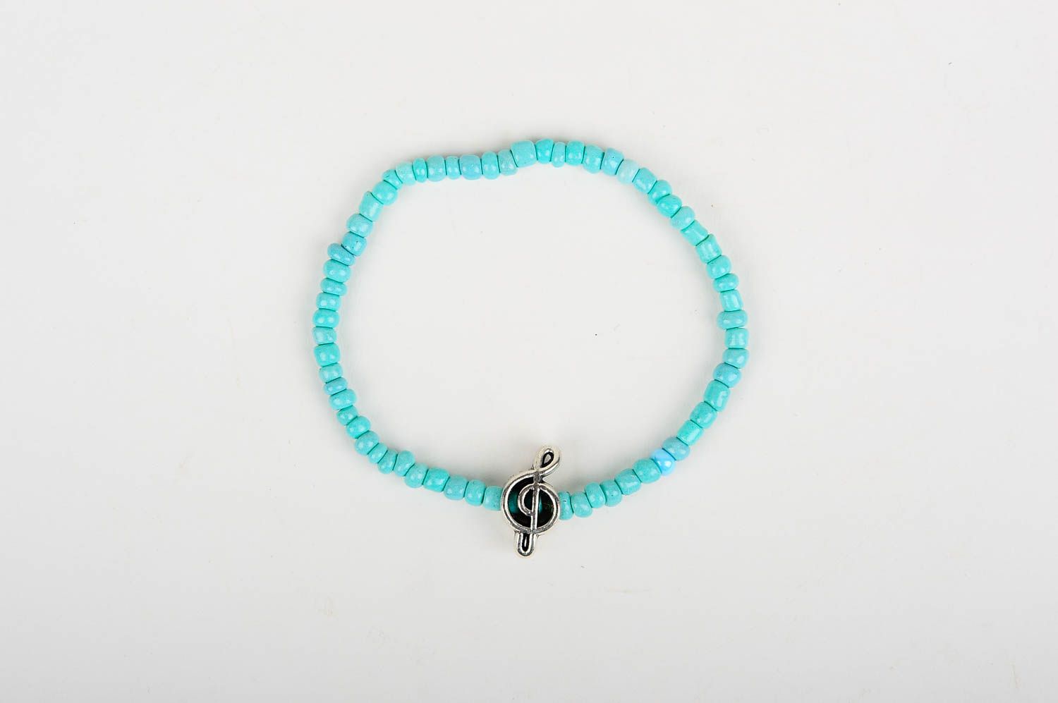Turquoise handmade beaded bracelet with treble clef charm for young girls photo 1