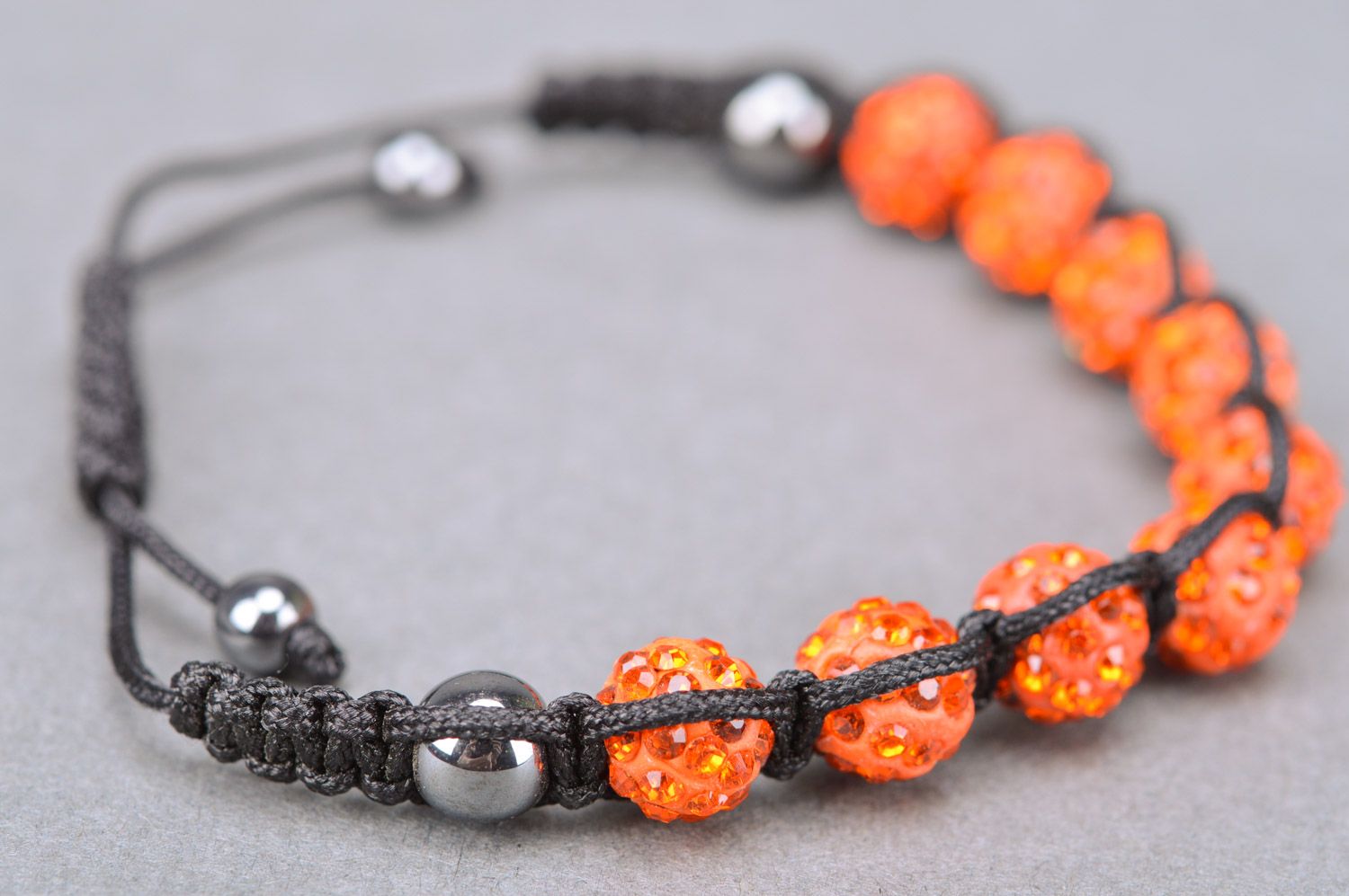 Bright orange handmade wrist bracelet woven of threads and beads with adjustable size photo 5