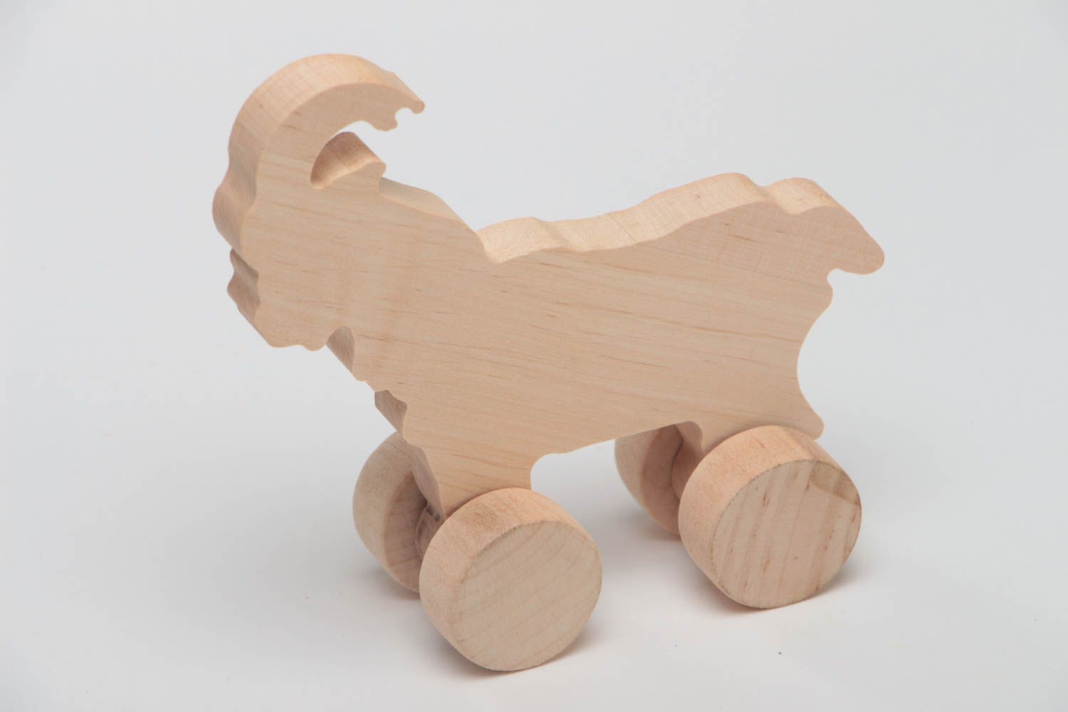 Juguete sobre ruedas de madera pieza para decoupage hecho a mano cabra foto 2