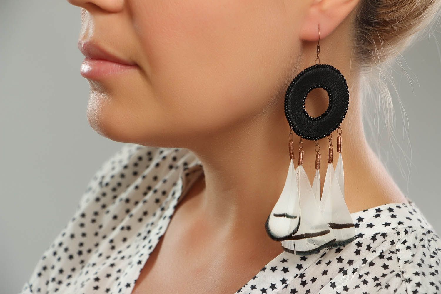 Earrings made of leather and feathers photo 4
