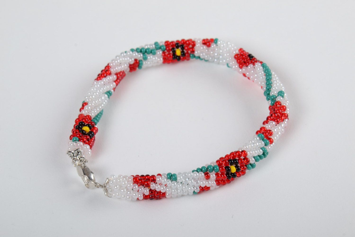 Festive white handmade beaded cord bracelet with floral motives photo 2