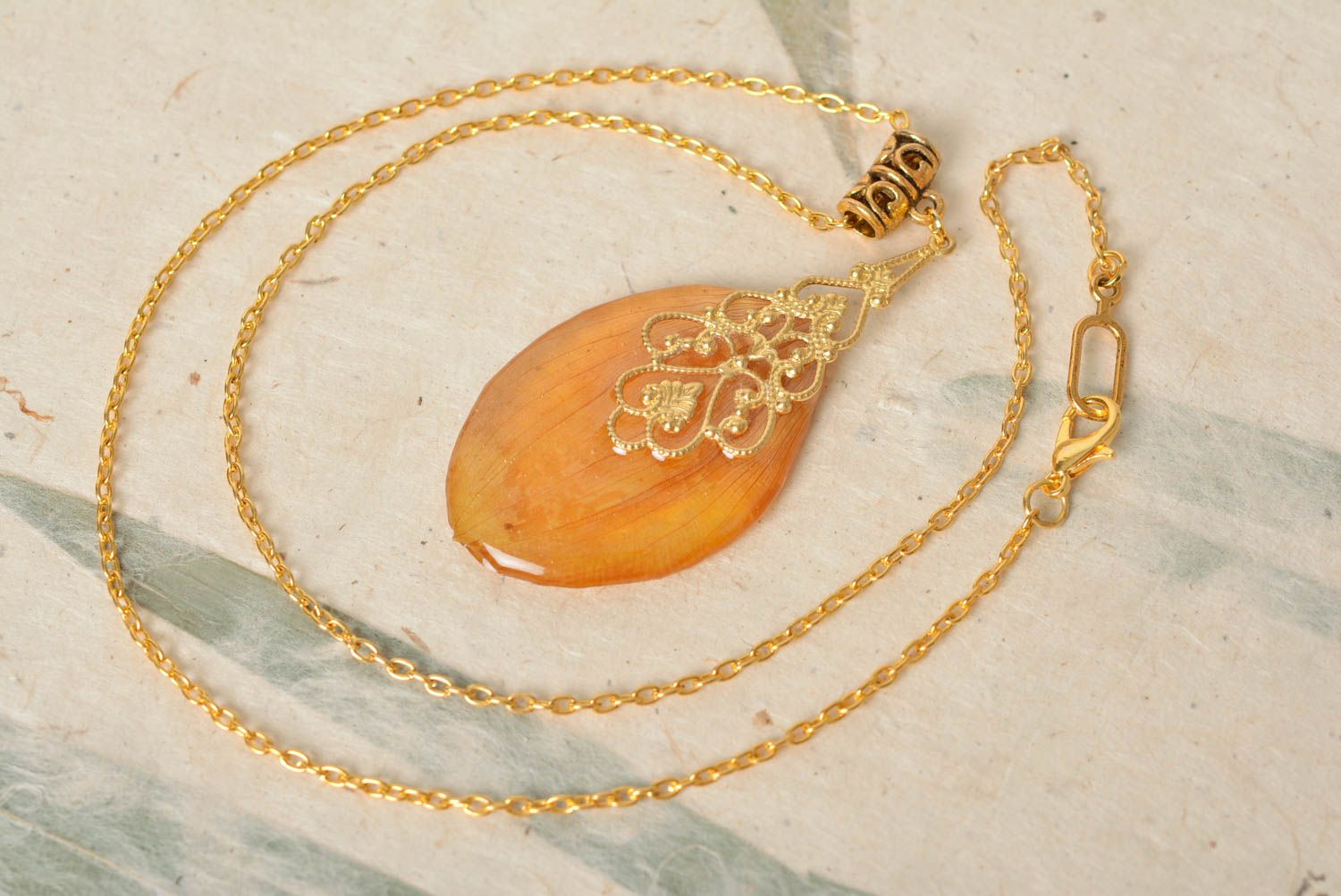 Beautiful handmade yellow pendant with flower petal coated with epoxy photo 1
