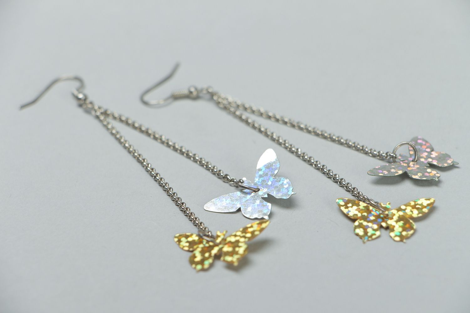 Metal earrings with charms in the shape of butterflies photo 2