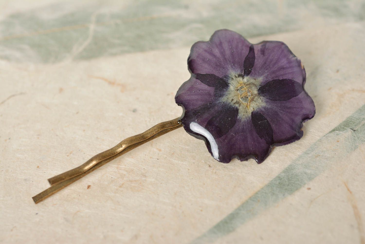Handmade designer decorative hair pin with violet dried flower in epoxy resin photo 1