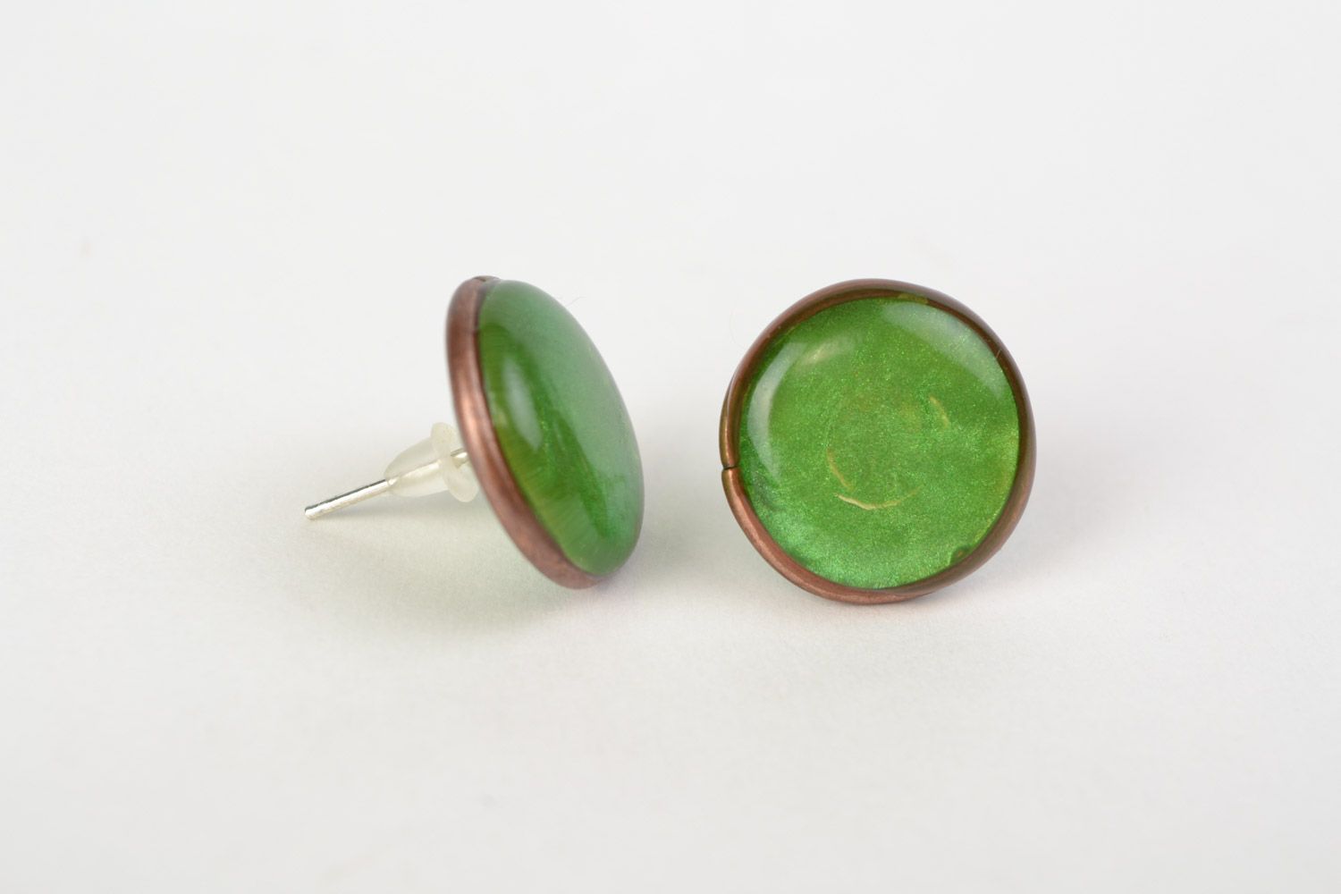 Handmade small epoxy resin stud earrings of round shape and green color photo 1
