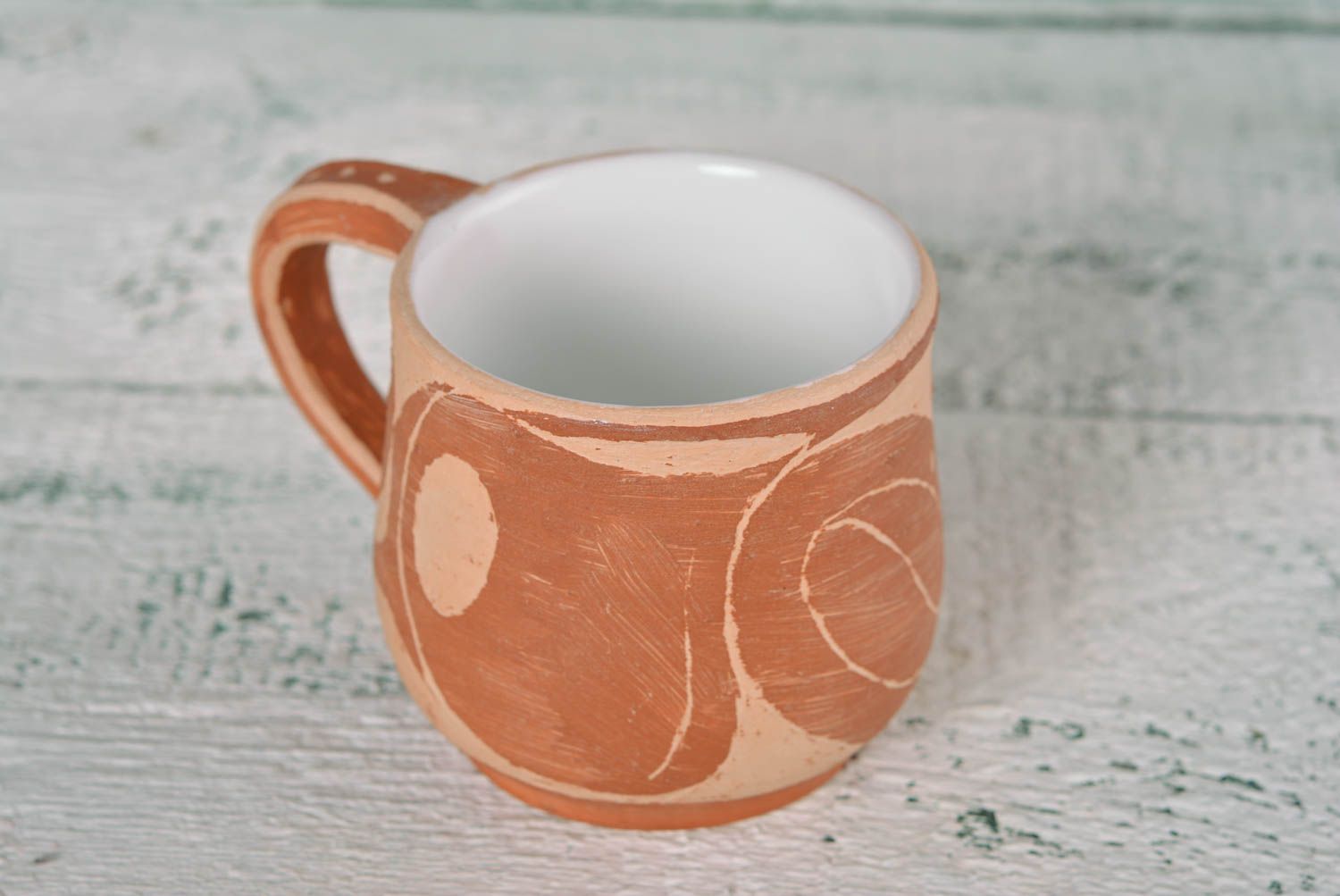 Rustic style clay not glazed cup in light brown and beige colors and handle photo 2