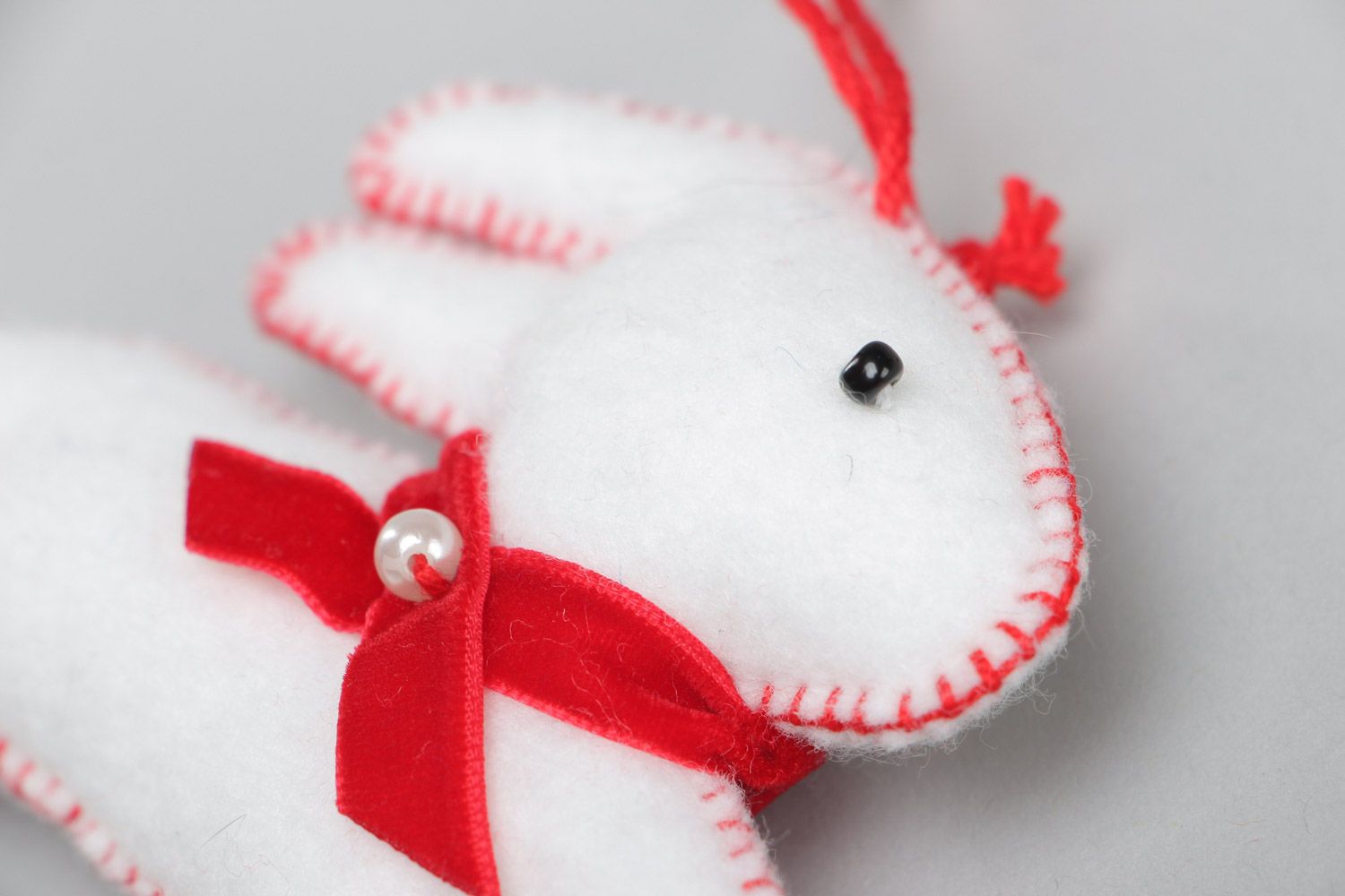 Handmade white decorative toy Rabbit sewn of felt with eyelet interior decoration photo 3