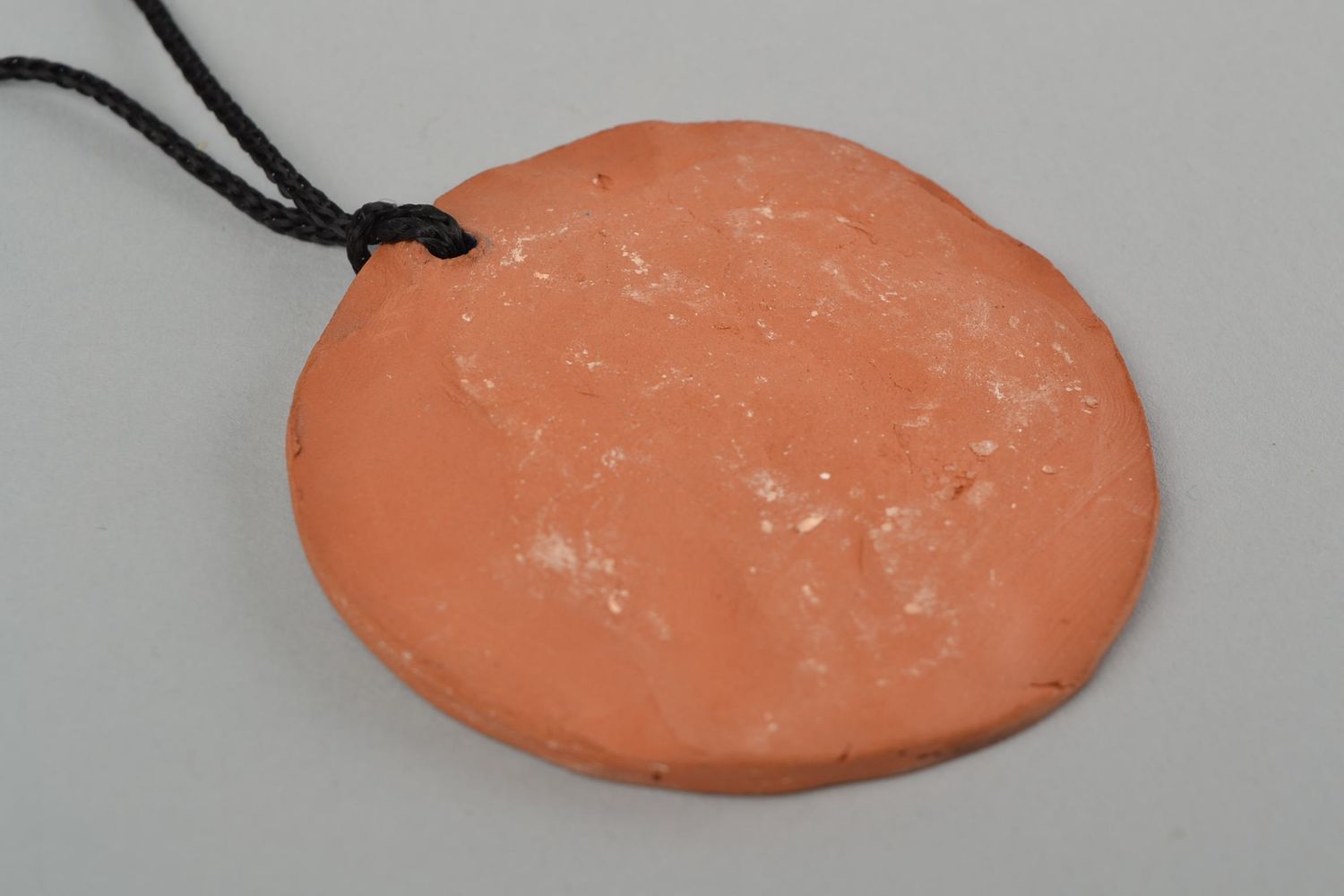 Handmade women's designer ceramic round pendant with relief ornament on cord photo 5