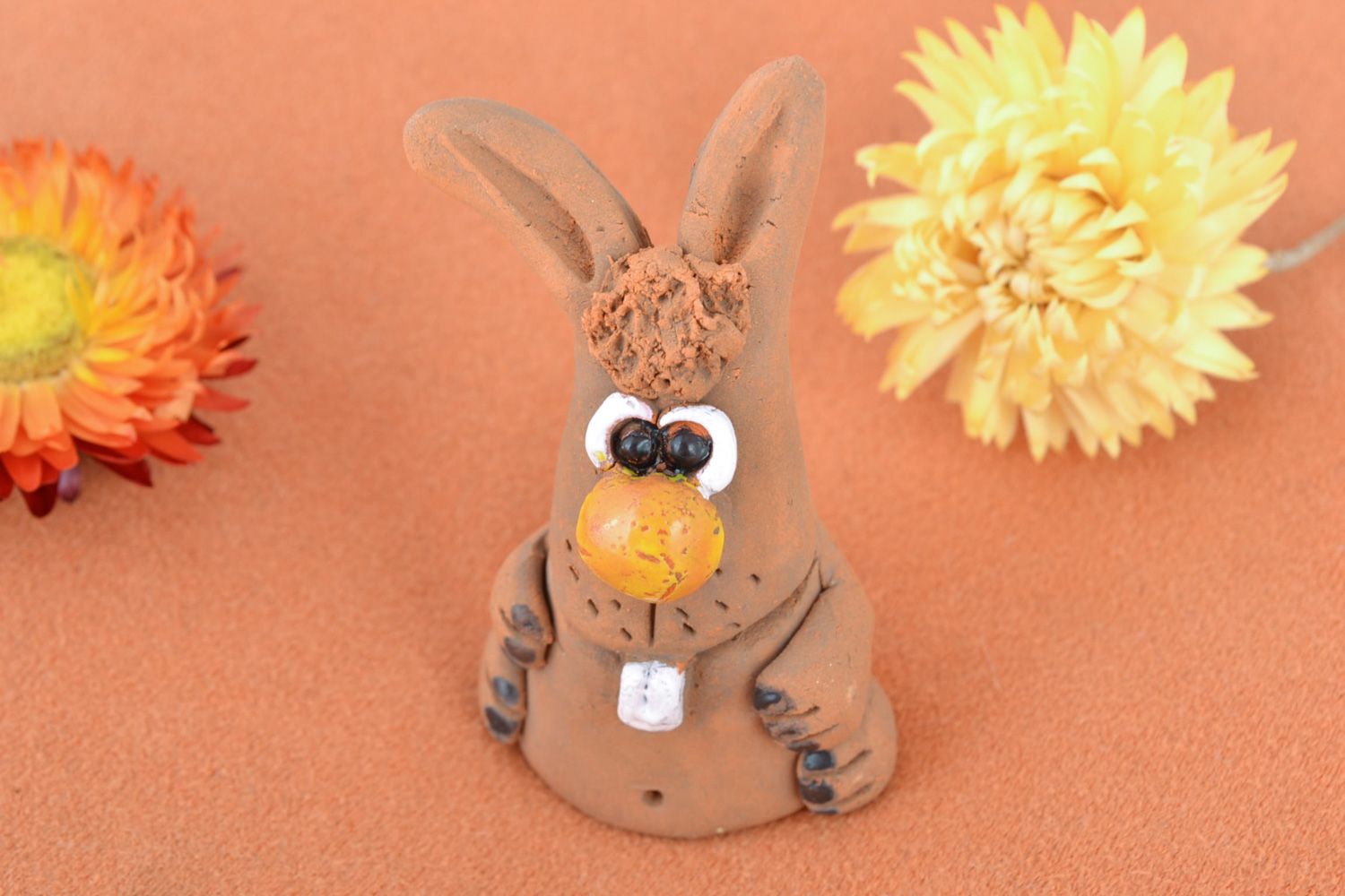 Small funny handmade ceramic figurine of rabbit coated with glaze for present photo 1
