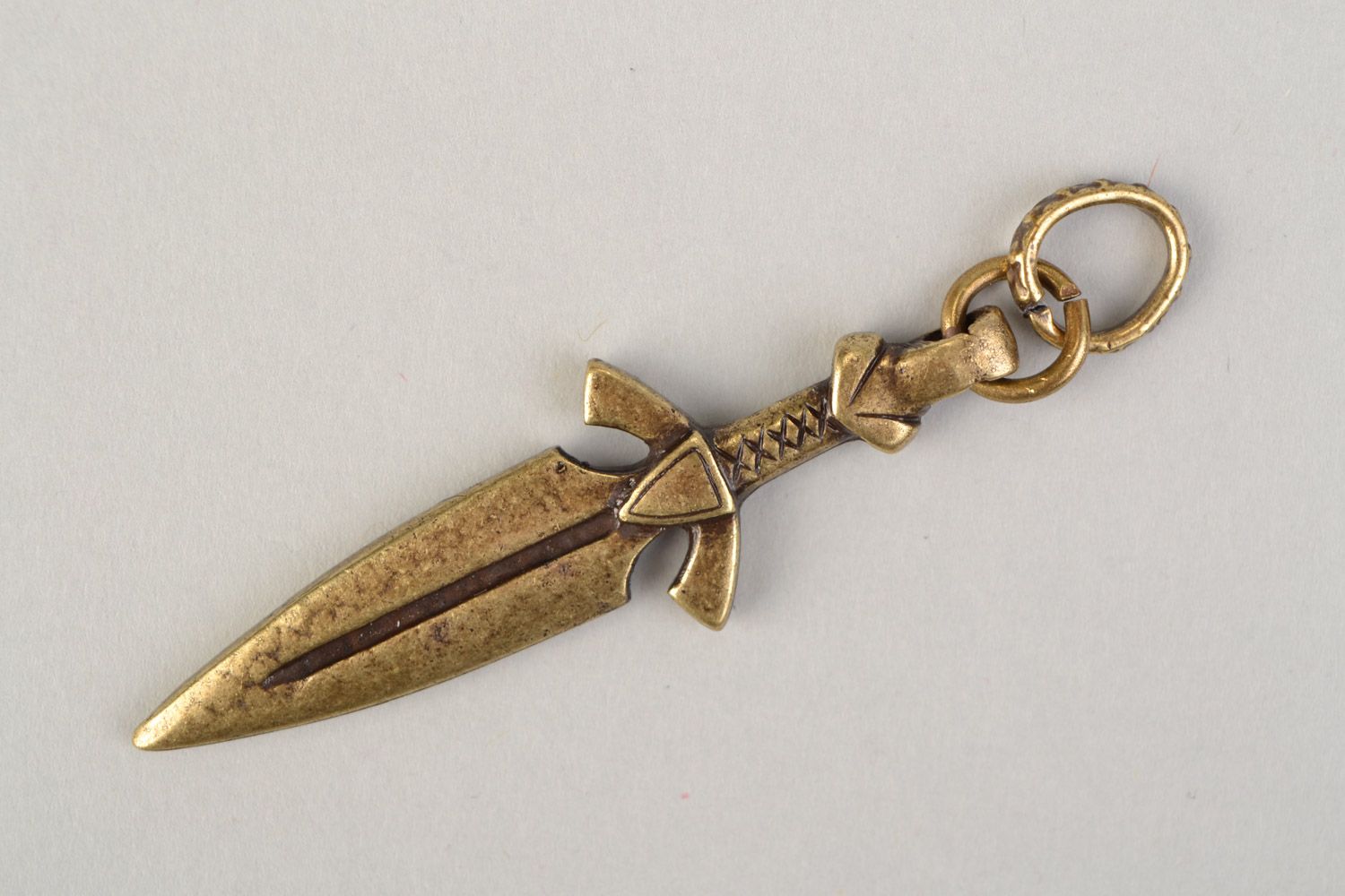 Handmade pendant in the shape of bronze knife cast with the use of permanent mold photo 4