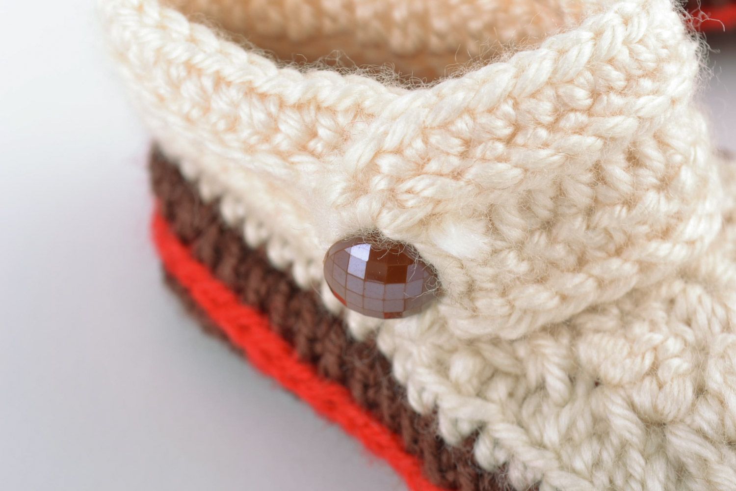 Light handmade knitted wool baby booties with beads and brown outsole photo 4