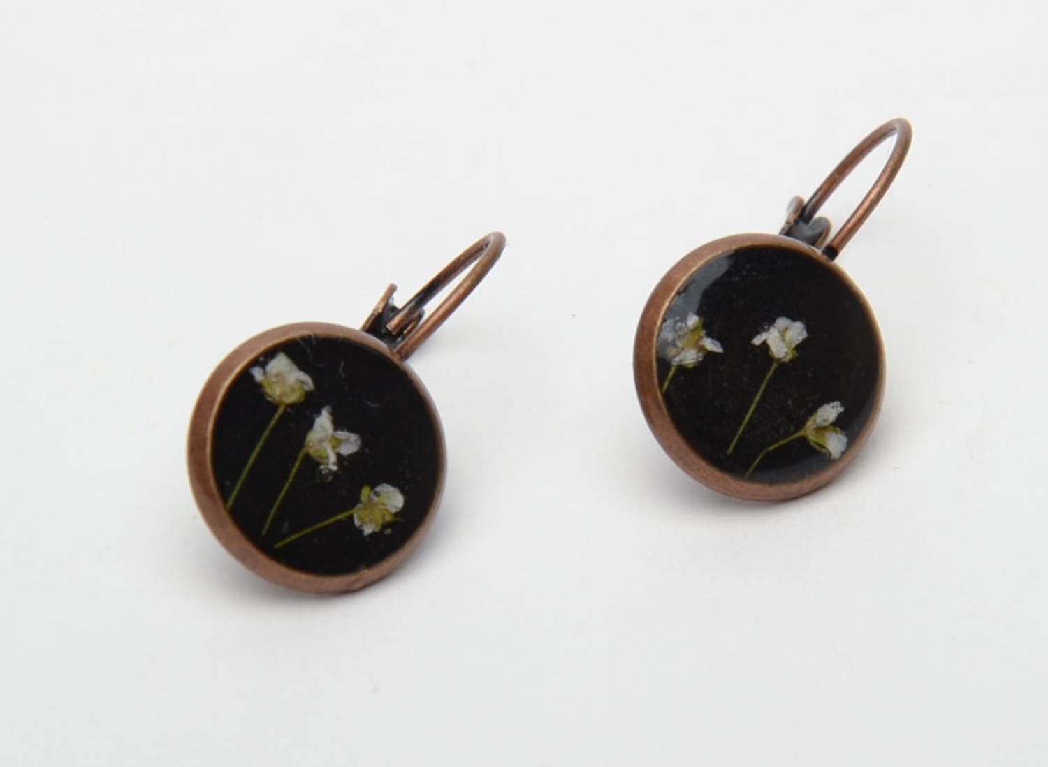 Round black earrings with natural flowers photo 3