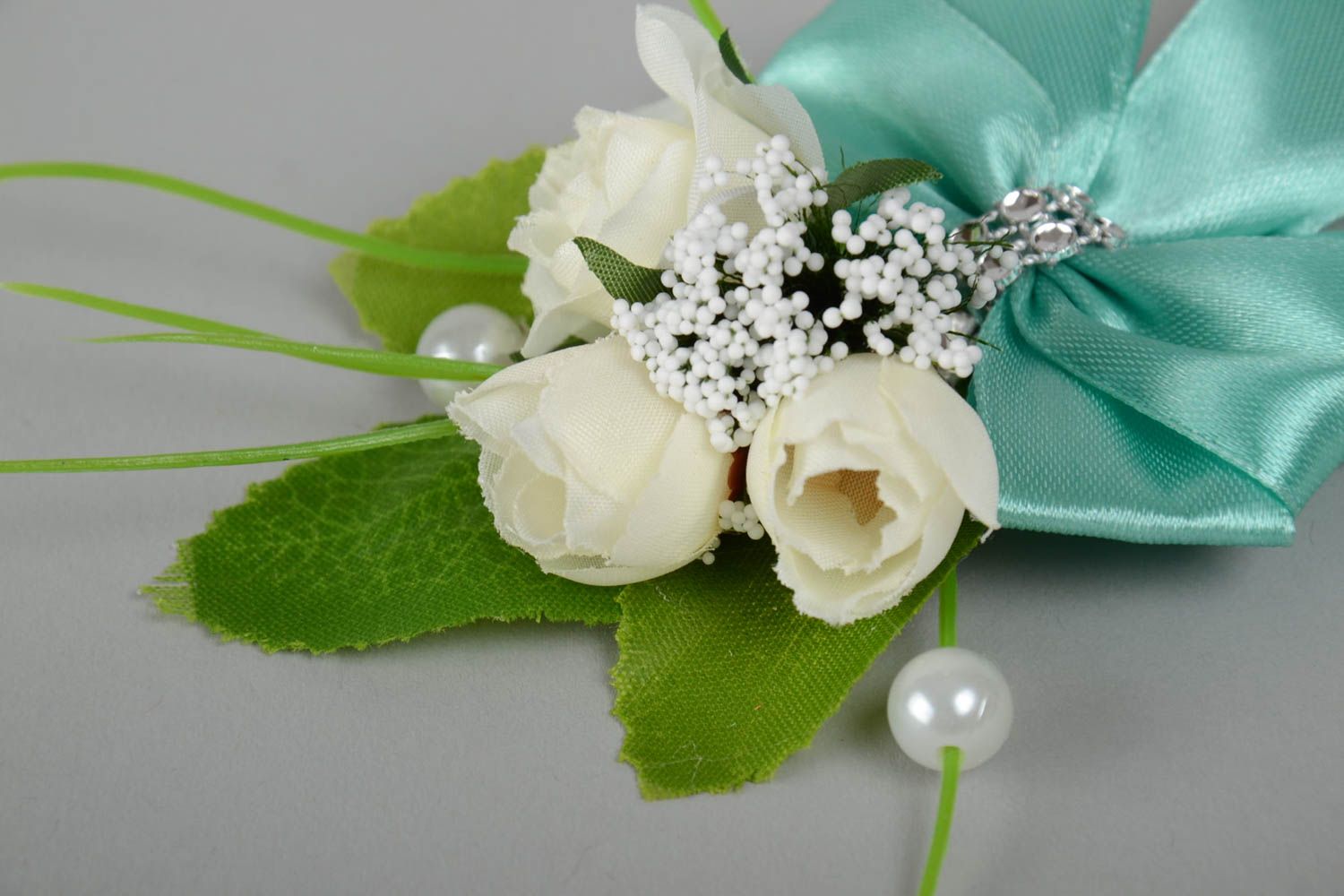 Beautiful handmade boutonniere for bride or groom of light color with flowers photo 4
