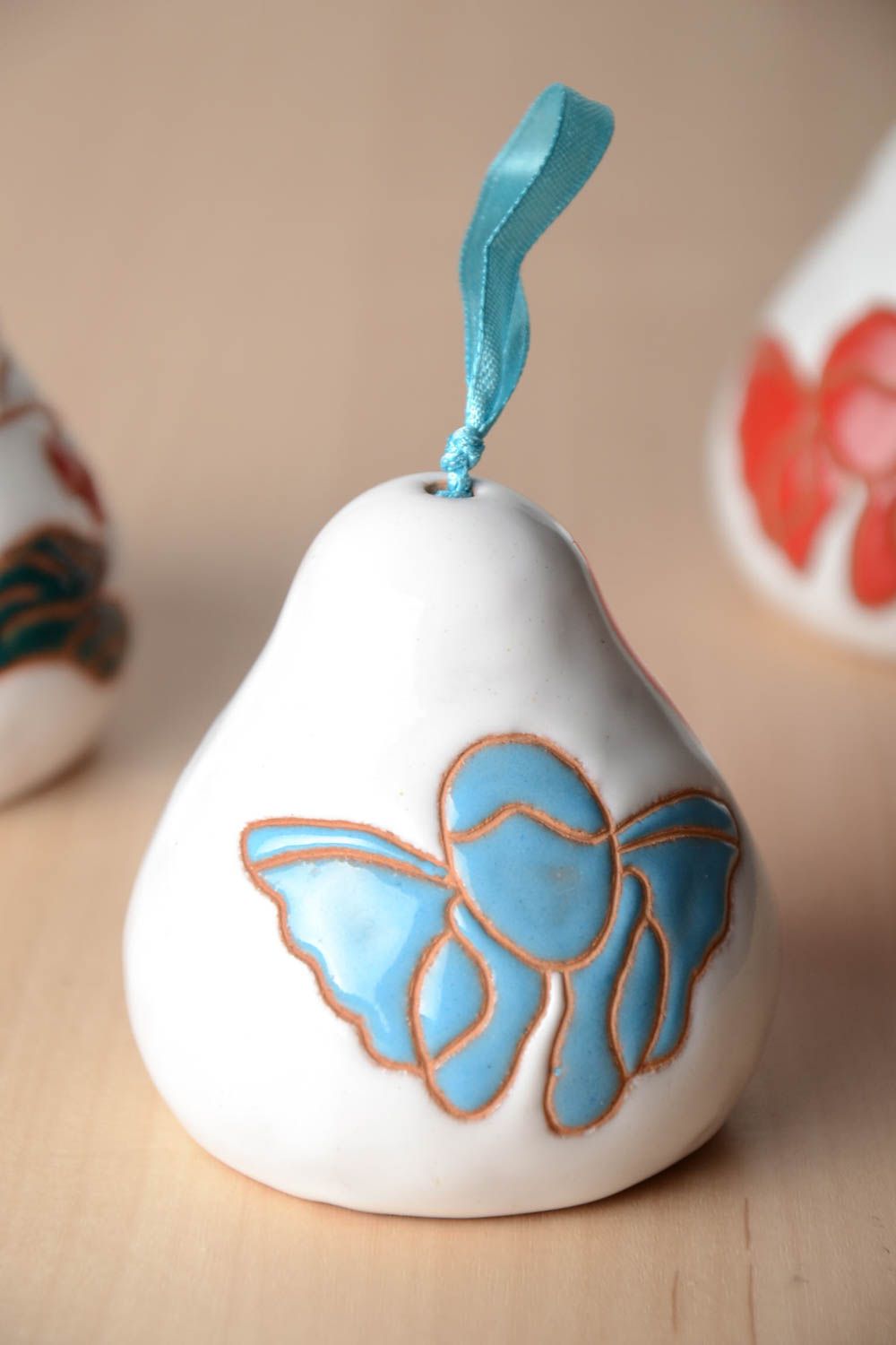 Handmade decorative white painted ceramic bell with blue angel on ribbon photo 1