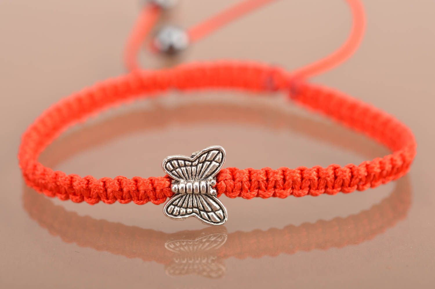 Handmade woven thin cute red bracelet made of silk threads with butterfly photo 2