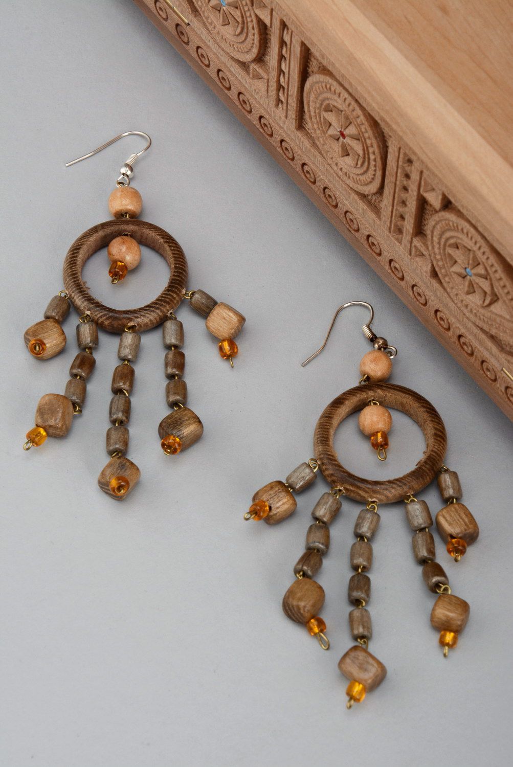 Decorative earrings made from wood with beads photo 1