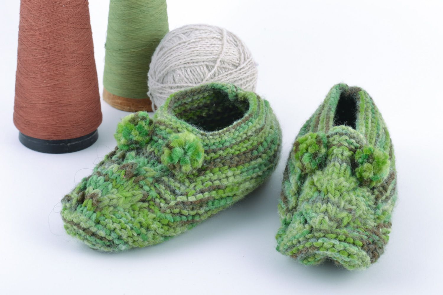 Handmade knitted half-woolen house slippers with pompoms of green color photo 1