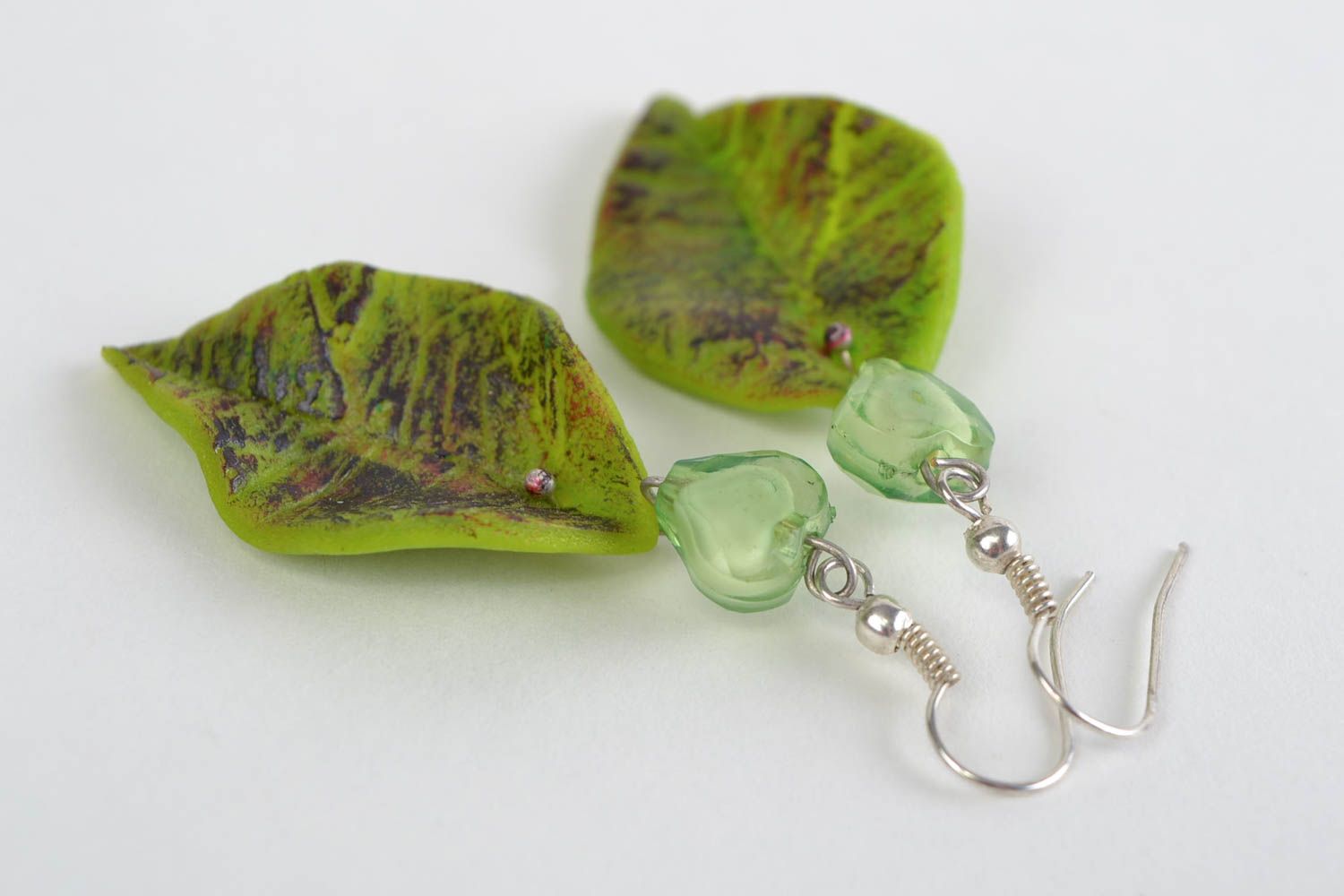 Large handmade green polymer clay earrings in the shape of leaves photo 1