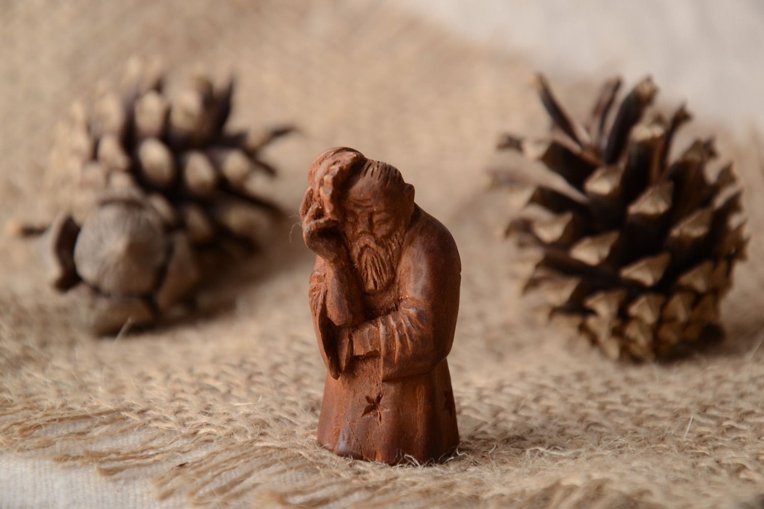 Handmade miniature carved wooden figurine of wise man for interior decoration photo 1